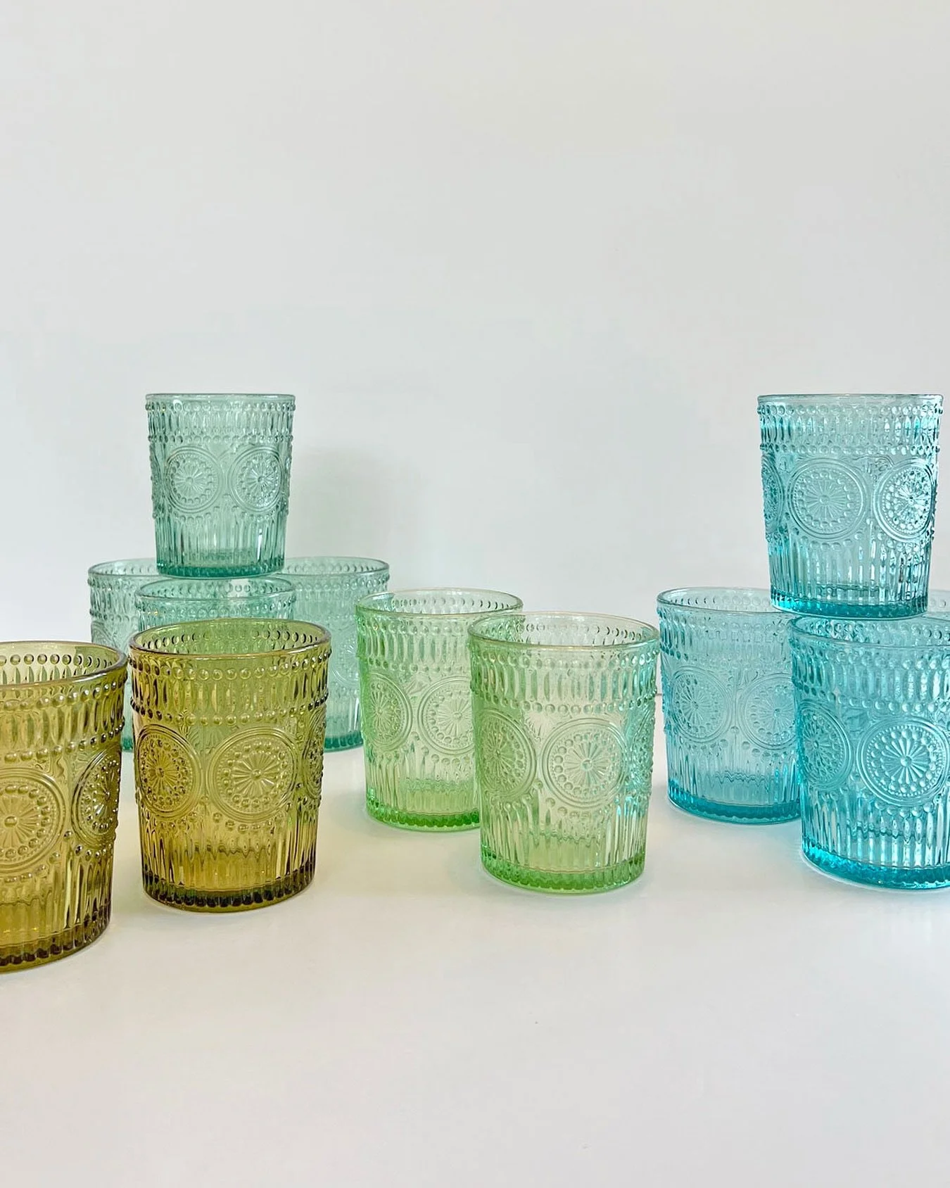 Blue and green jelly jar glasses catch the light just right&mdash;simple, timeless, and full of vintage charm! 
Available at Star Provisions market