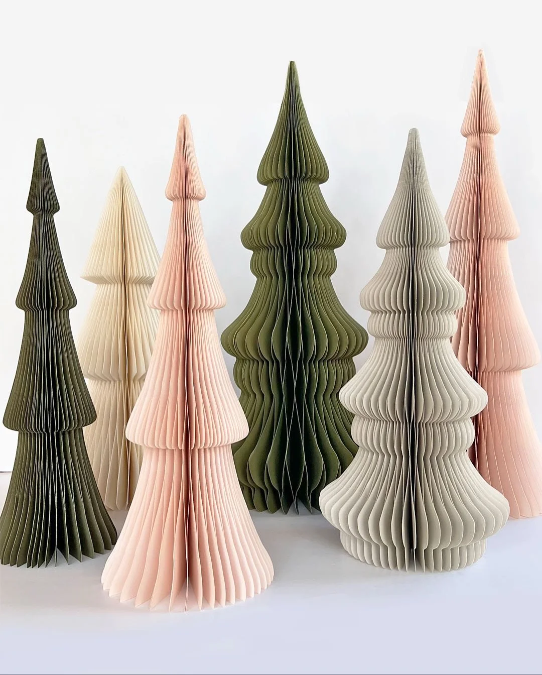 We have the most beautiful paper trees in the market - a honeycomb design with a magnet to hold them open ( they also fold up and store away easily ) The holidays are going to be beautiful!