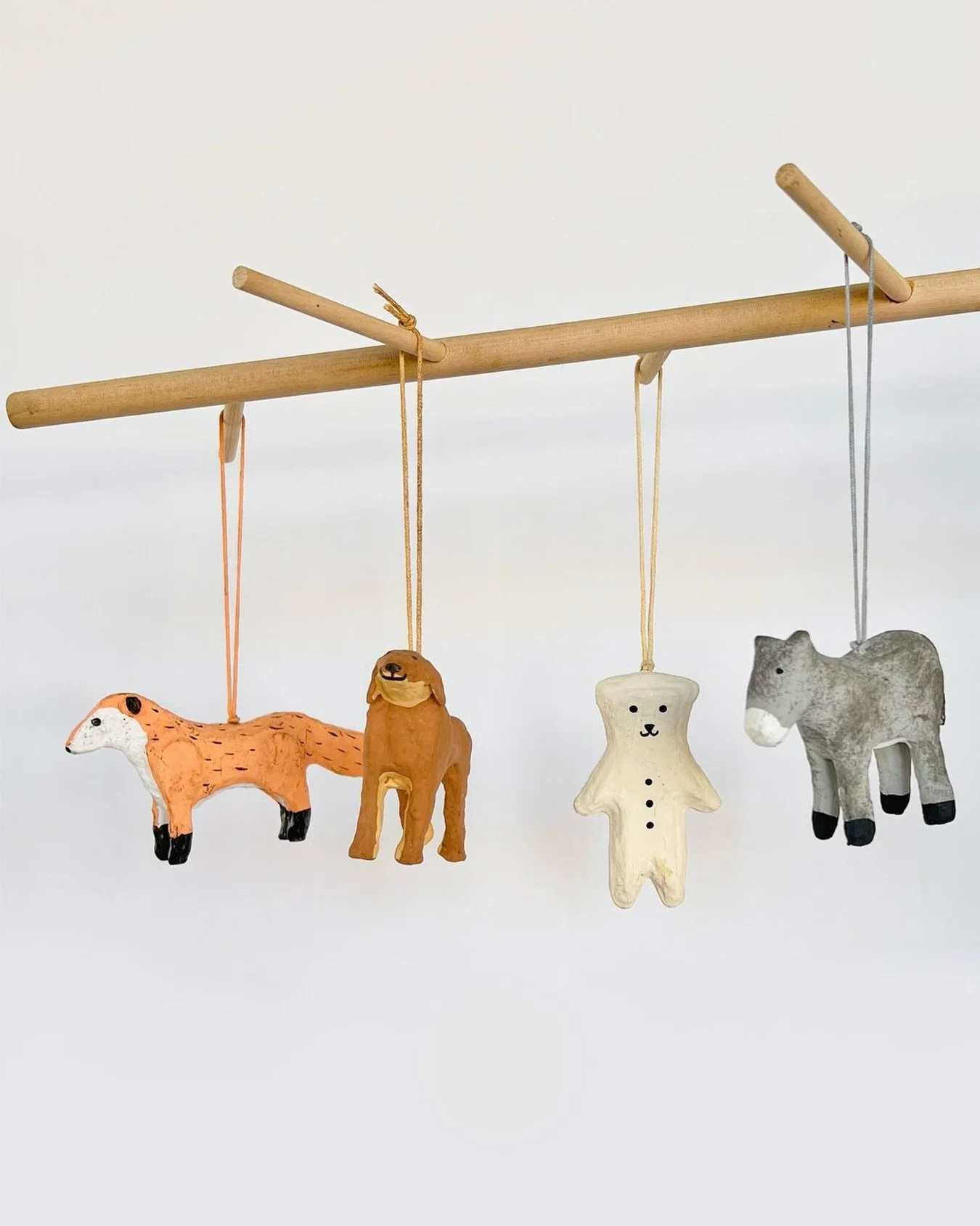 Some of our favorite ornaments in the market.. a collection of paper mache animals for the holiday tree 🎄