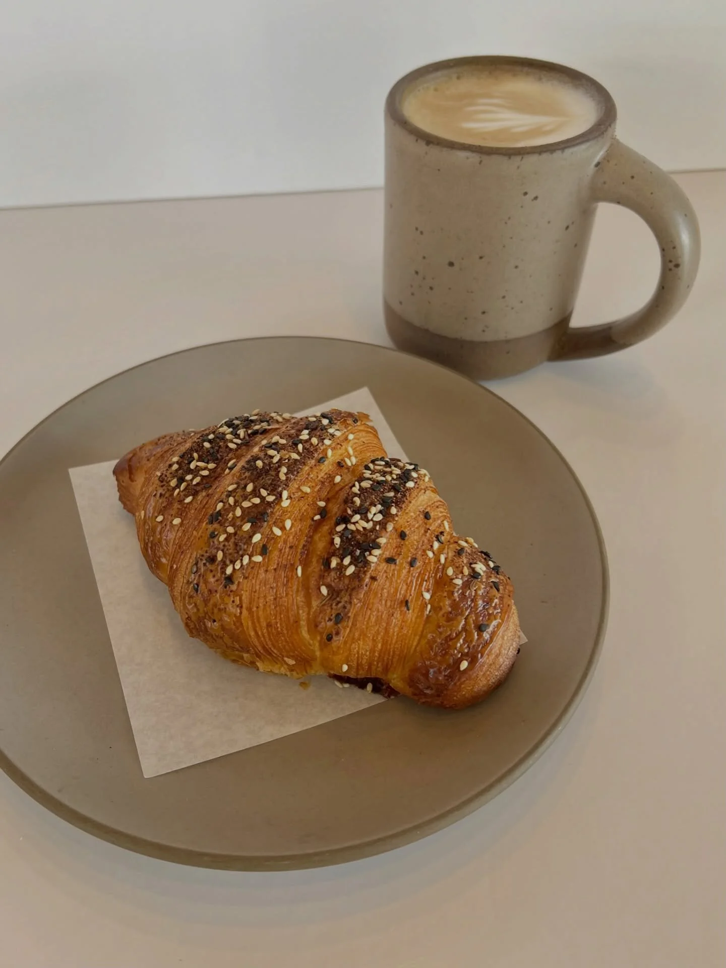 A favorite savory breakfast at Star &ndash; An Everything Croissant with a cream cheese filling and a latte!