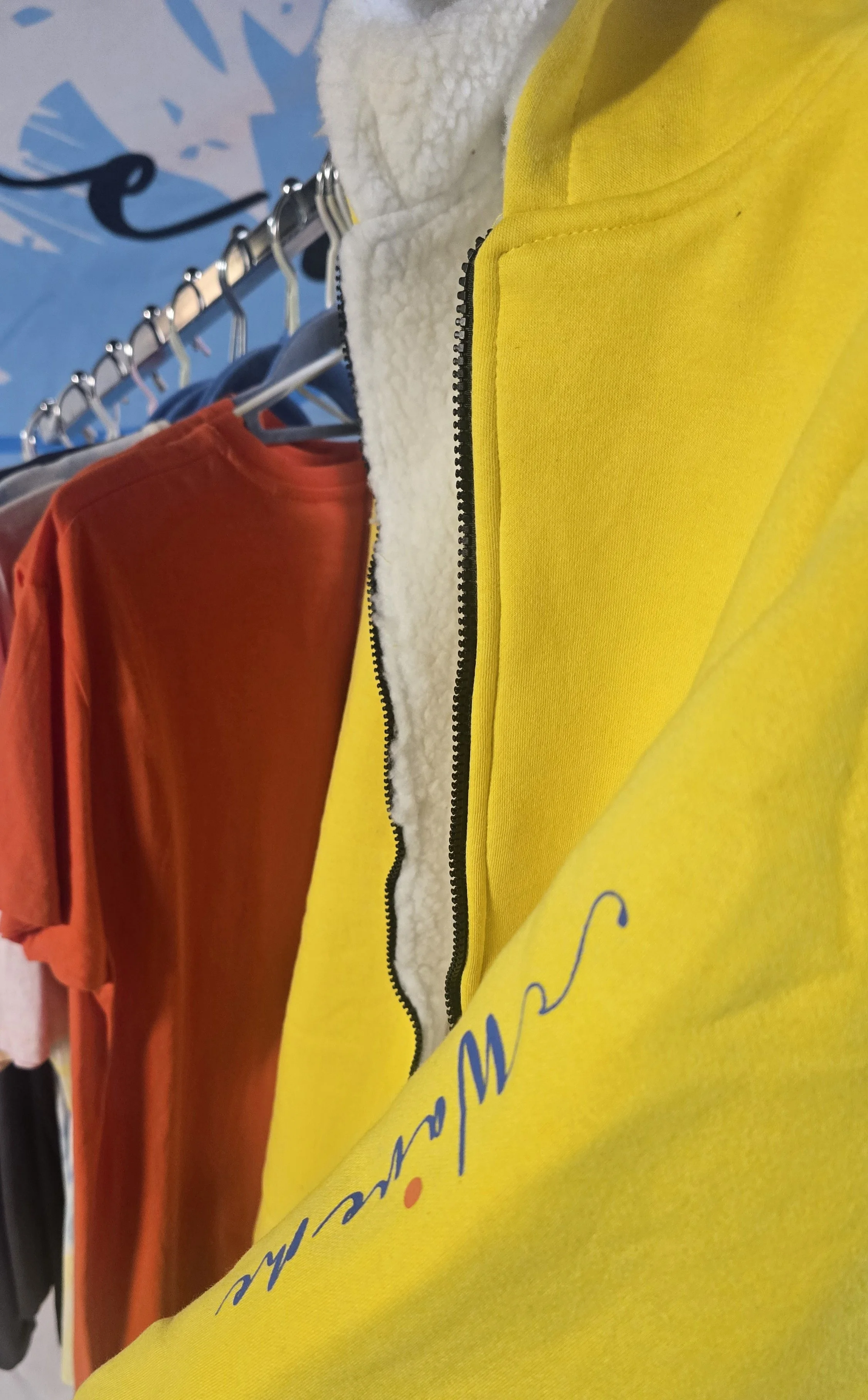Bright Yellow kids sherpa jacket on stall