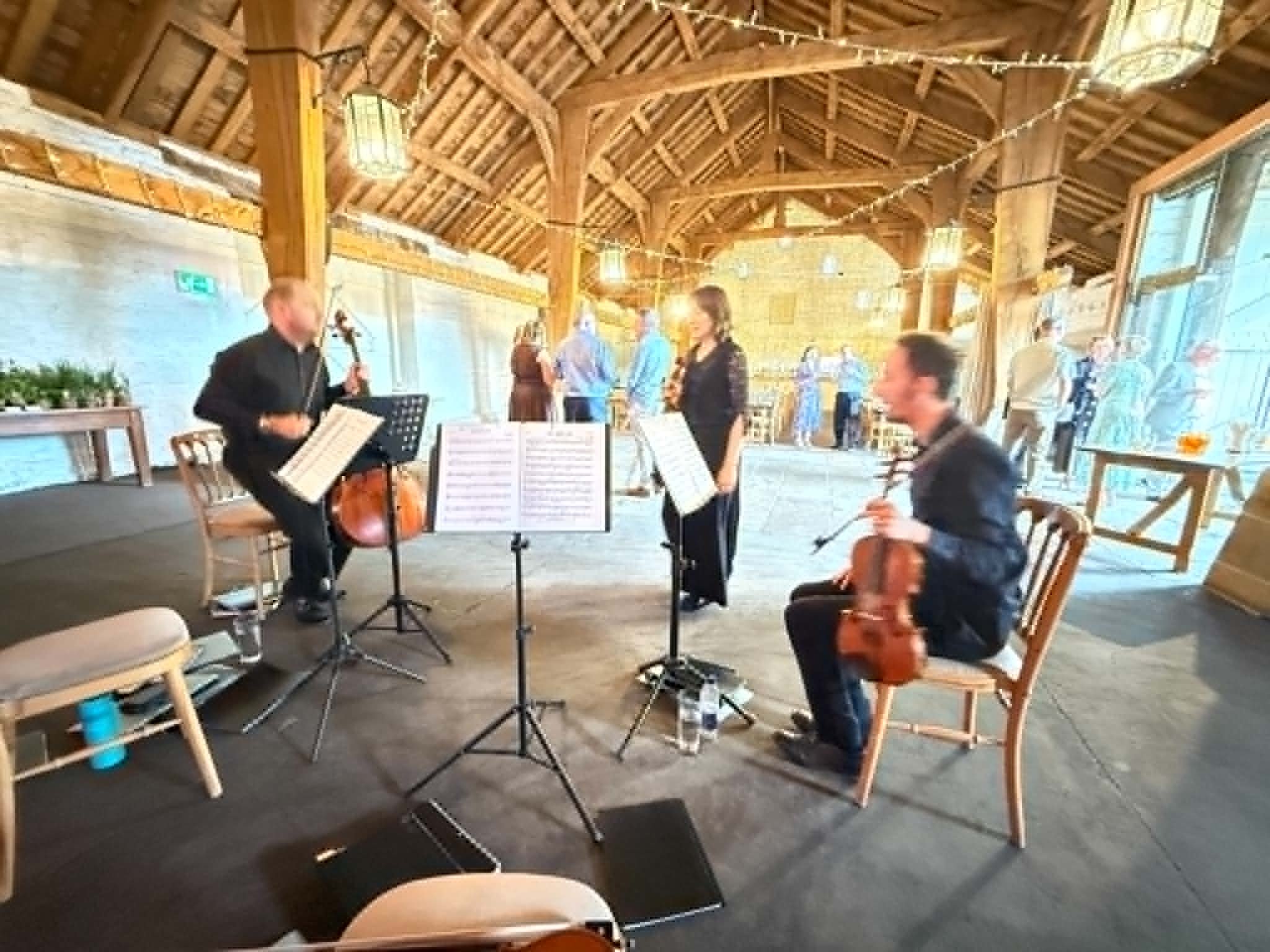 string-quartet-getting-ready-airedale-barn-east-riddlesden-hall.jpeg