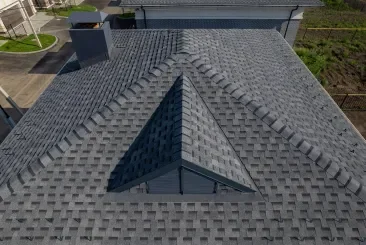 Architectural shingles on a modern roof design.