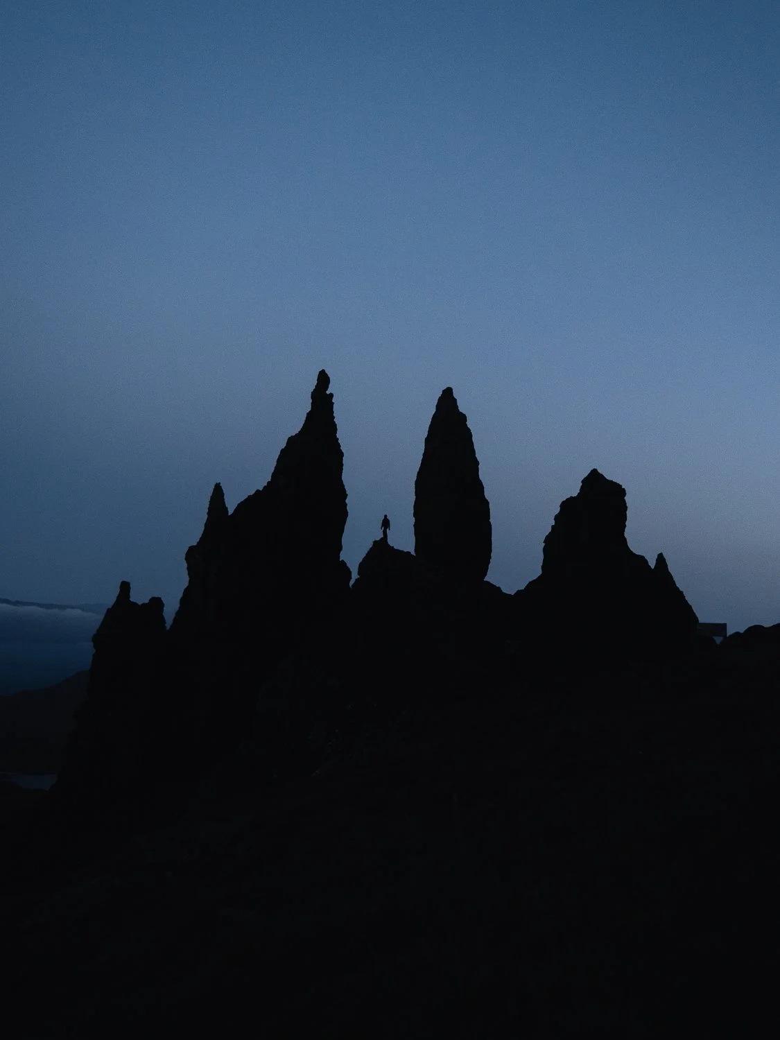 A silhouette of an Old Man of Storr on the Isle of Skye.