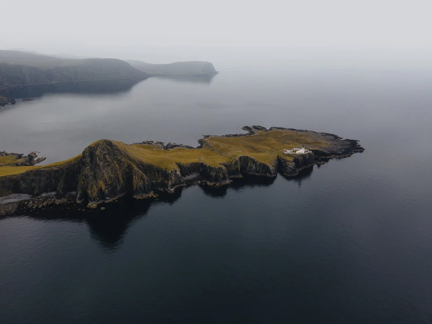 A moody and still conditions at Neist Point Lighthouse on Skye.