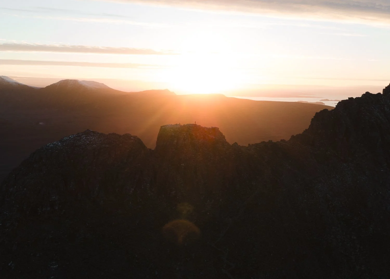 A panoramic view of the Stac Pollaidh's ridge during sunset.