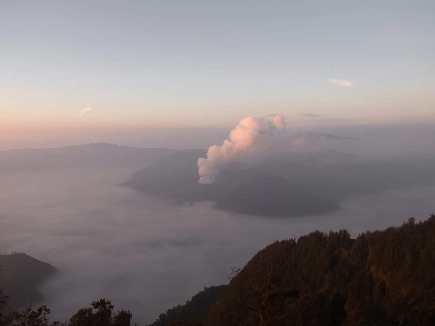 A panoramic view of a Bromo caldera with an inversion.