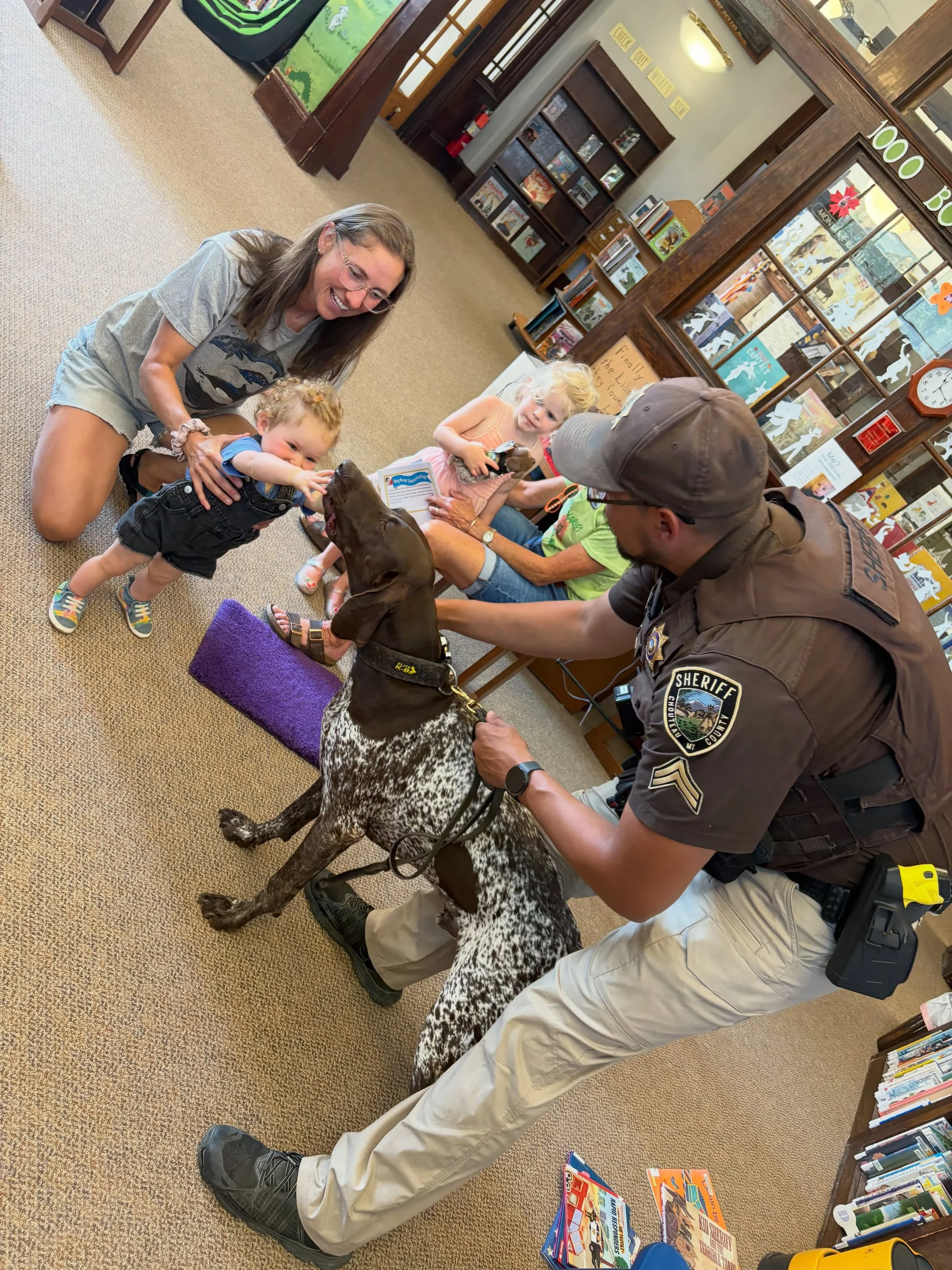 ~Today Is~

Today is the day that the storytime kids got to meet Benny!

Sheriff deputies Whitney Layne and Aaron Skunkcap visited the Thursday morning storytime to talk to the kids and introduce them to Benny the police dog. They also handed out she