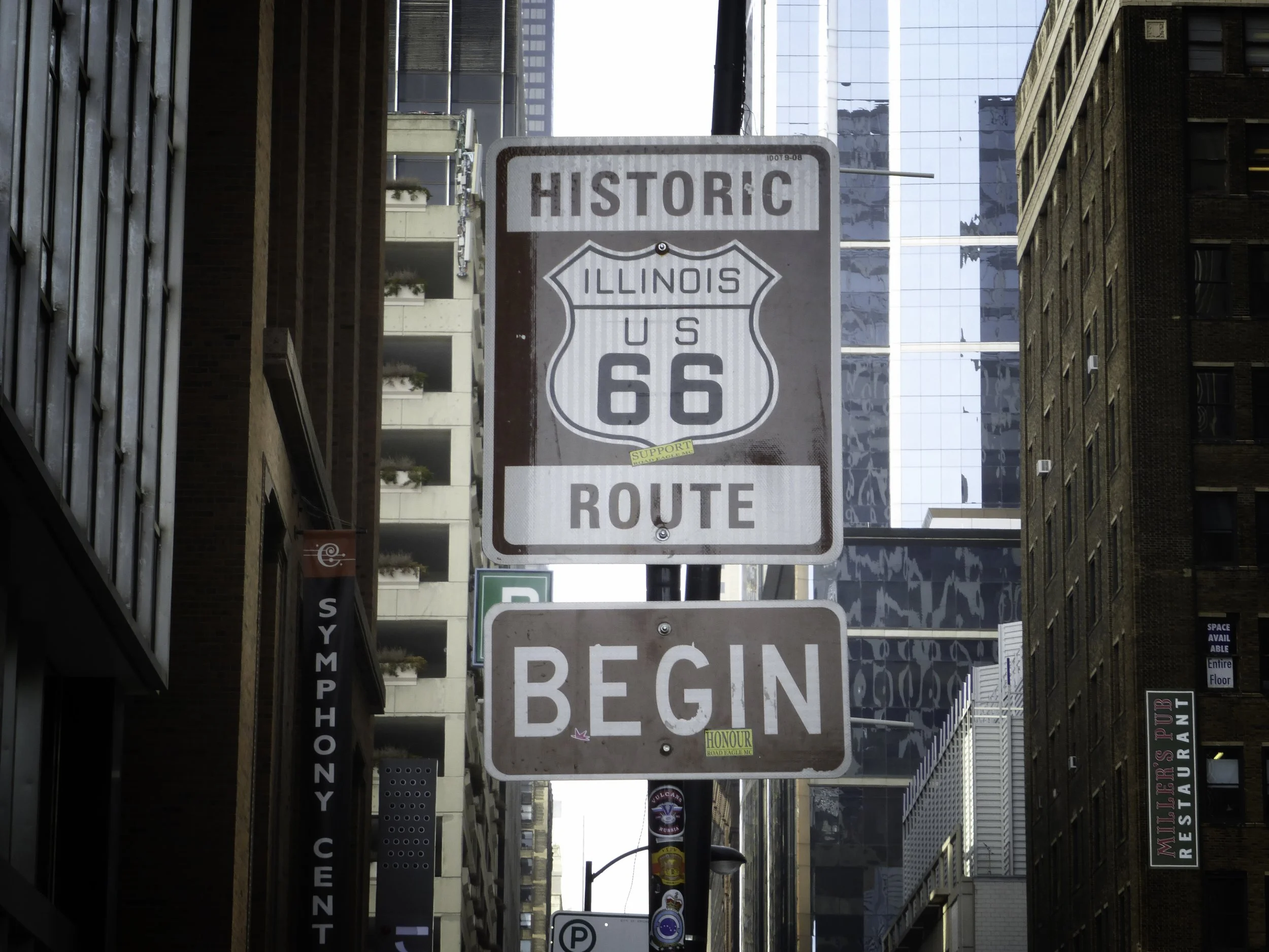 Vintage street sign for historic Route 66 in Illinois with the words "Begin" at the bottom.