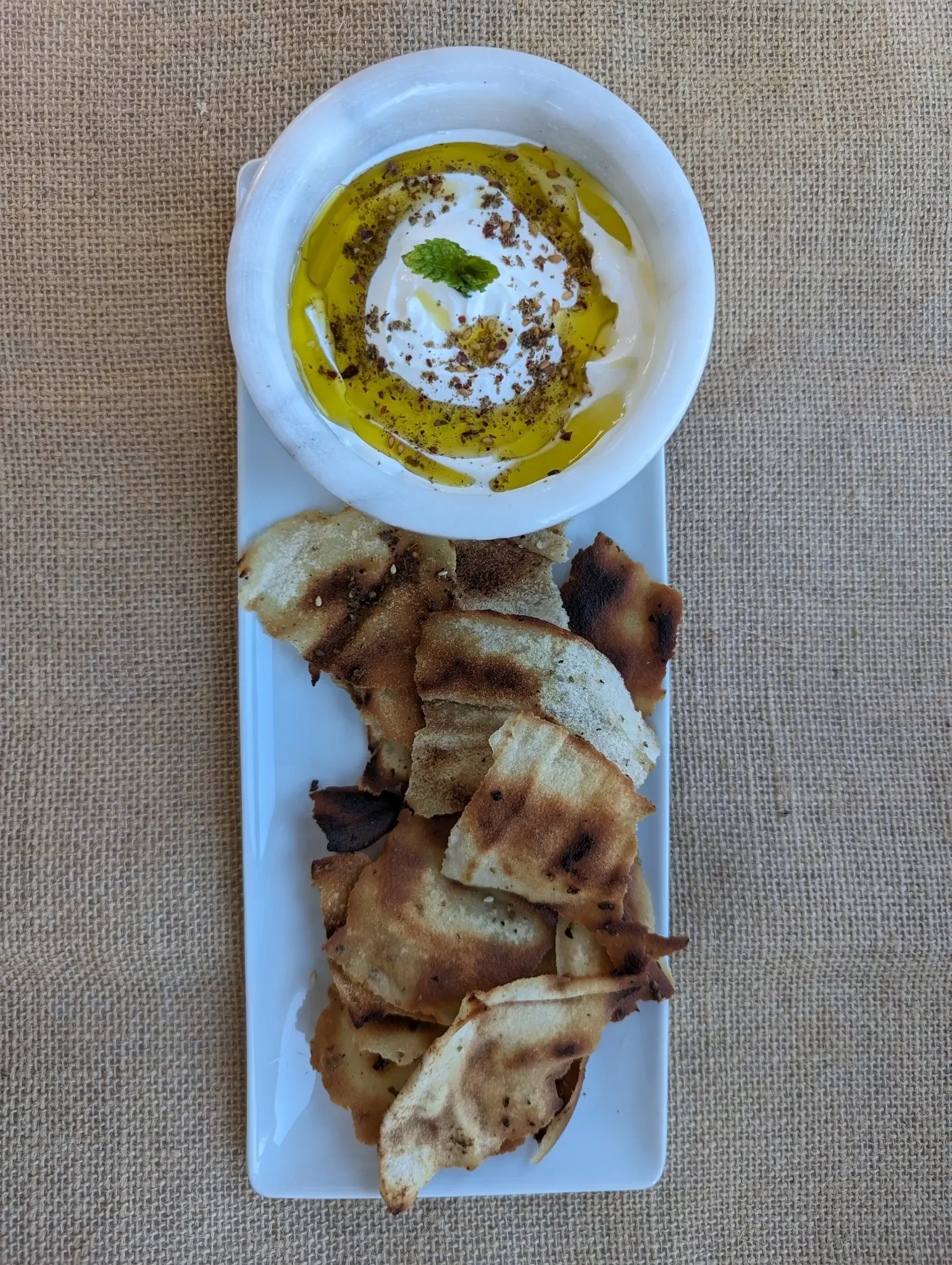 Labneh with pita chips toasted and sprinkled with Lebanese zaatar
