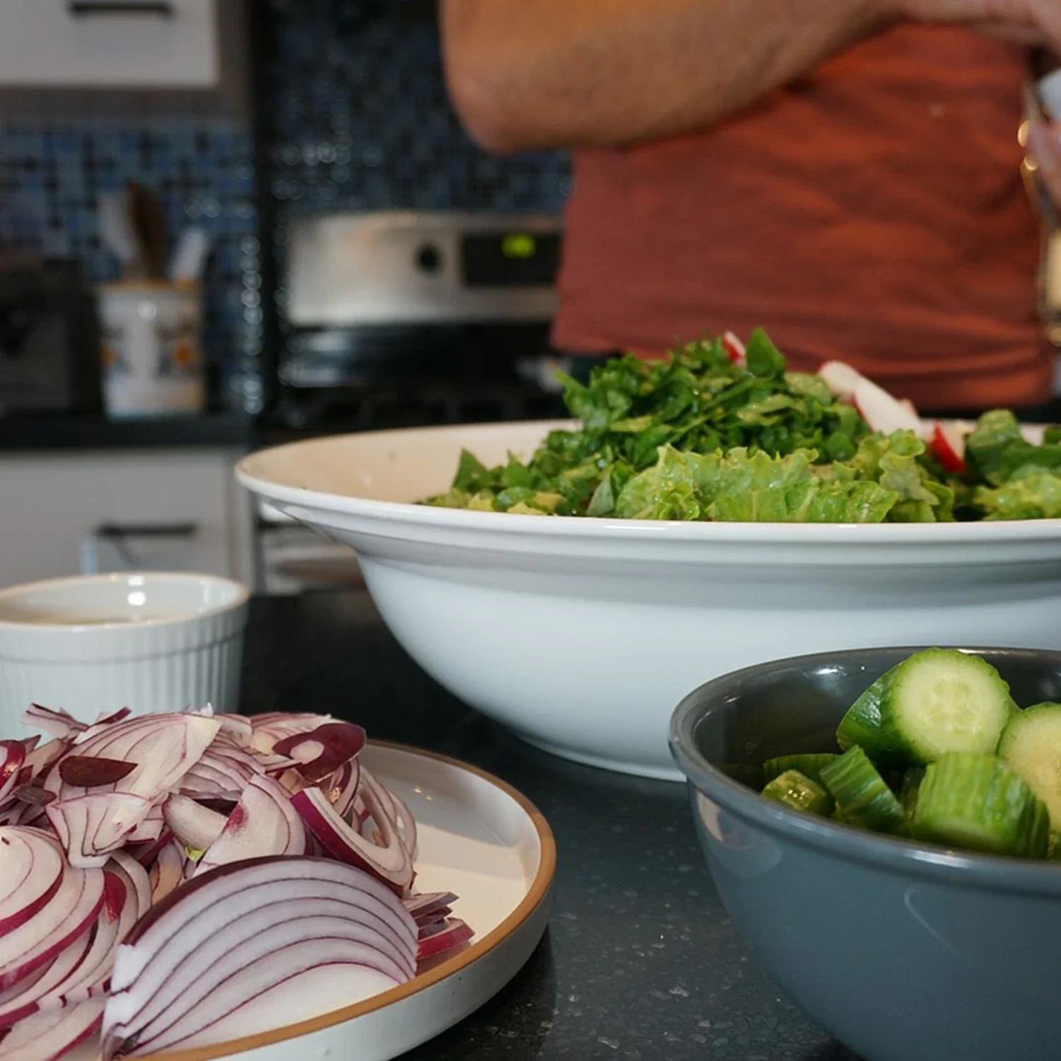 A fresh Mediterranean salad with floral and fragrant herb dressing