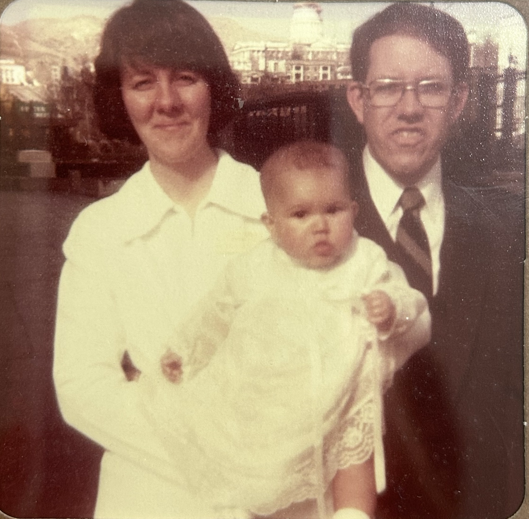 These images are shared by Melanie to offer a warm glimpse into her story and lived experience within adoption.

Description of Image:
This is a picture of Melanie around the time she came home to her adoptive parents, DeLynne and Floyd—capturing the