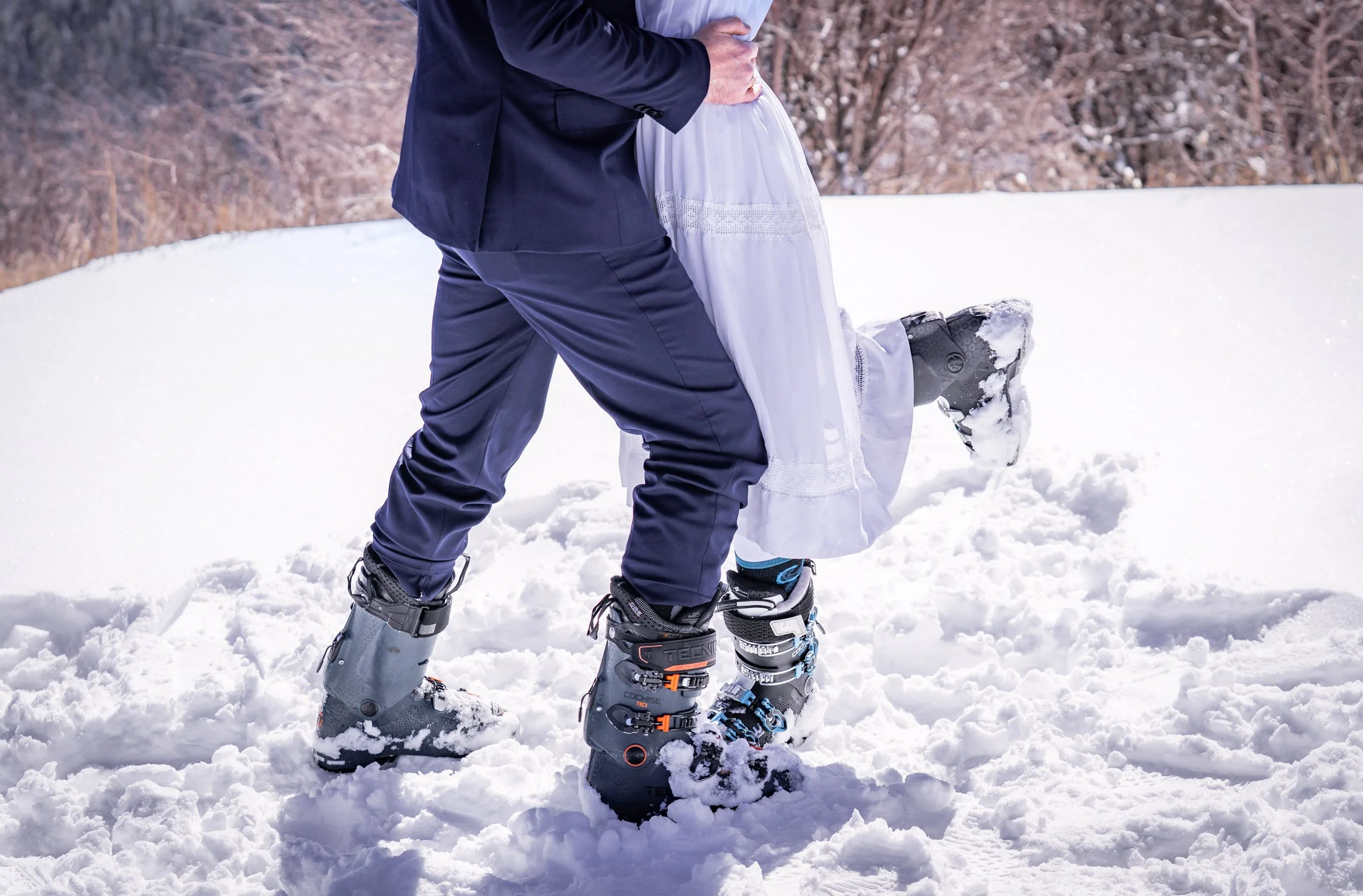 A close up shot of a bride and groom's ski boots in Colorado.