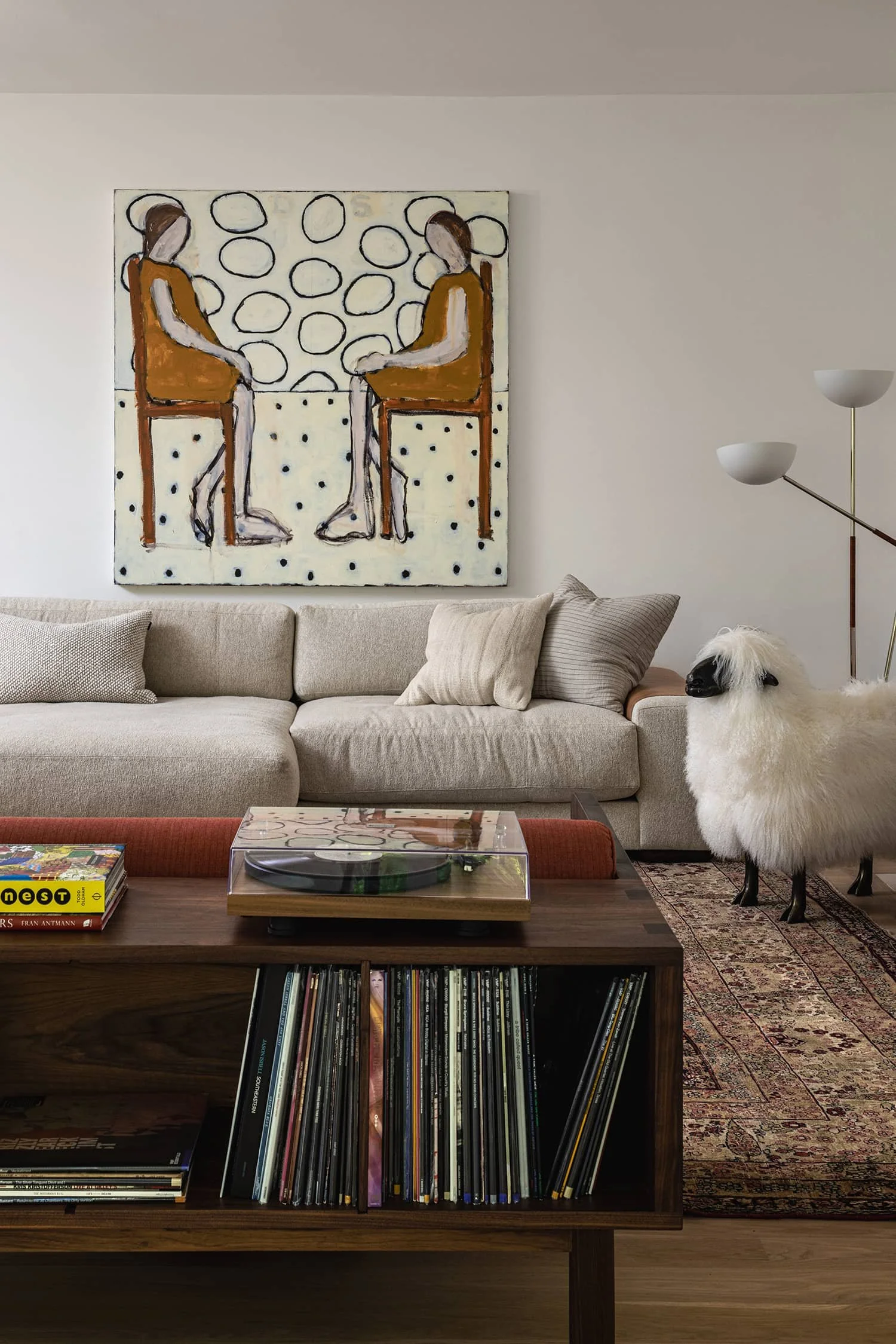 Living room with record player, playful art, and eclectic decor, designed by Fowlkes Studio in Washington, DC.