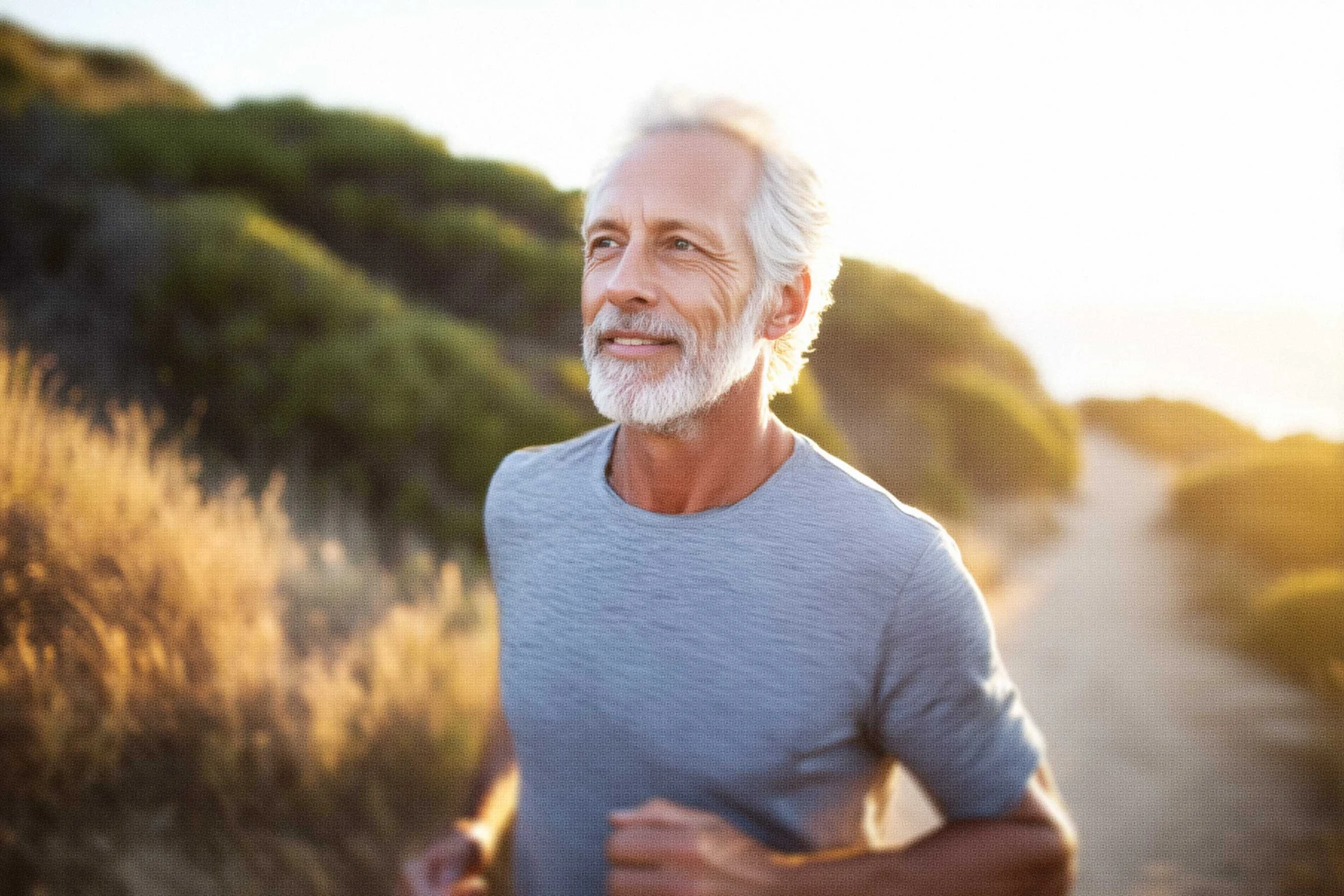 man with healthy kidneys running on beach trail
