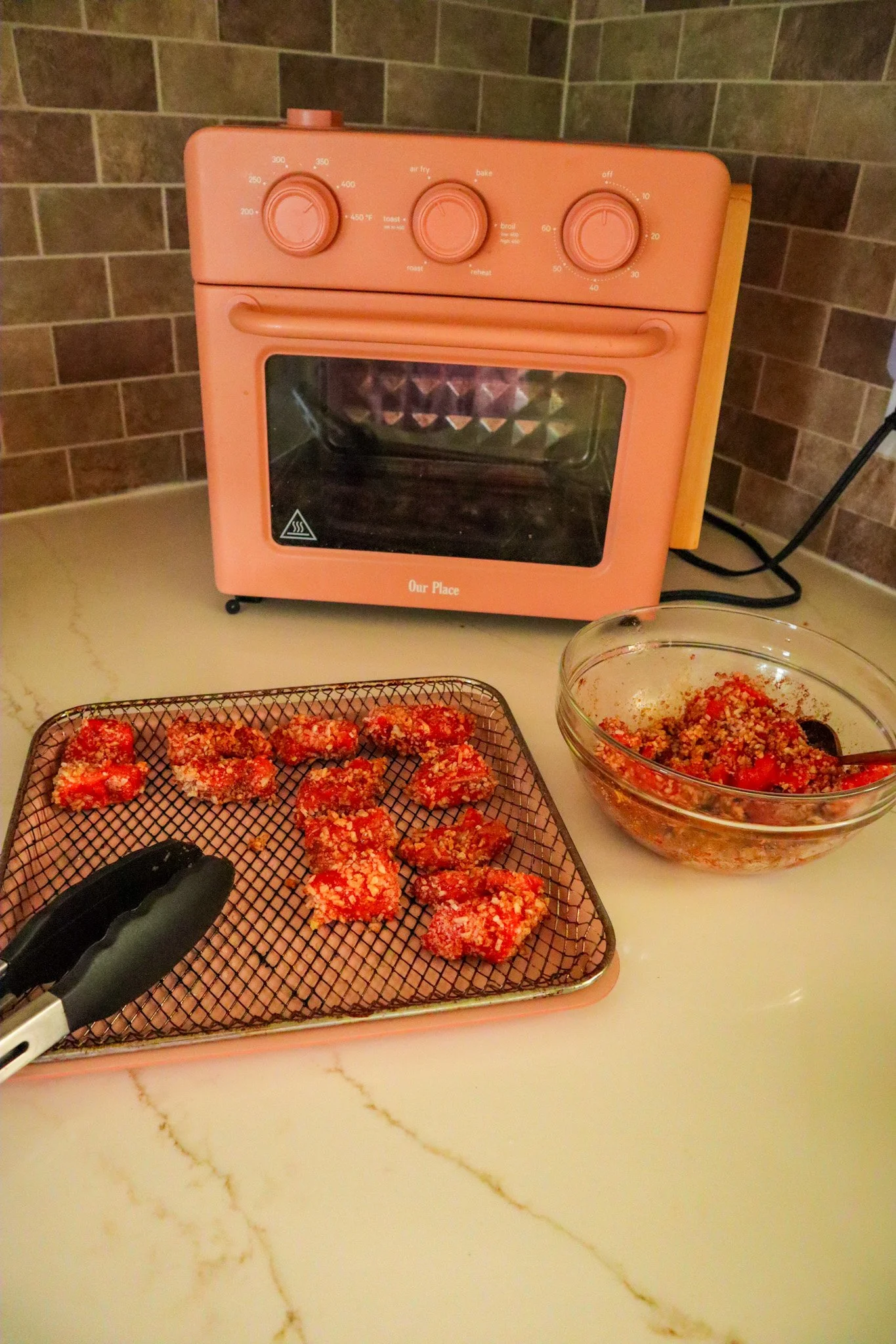 seasoned salmon bites in an even, single layer 