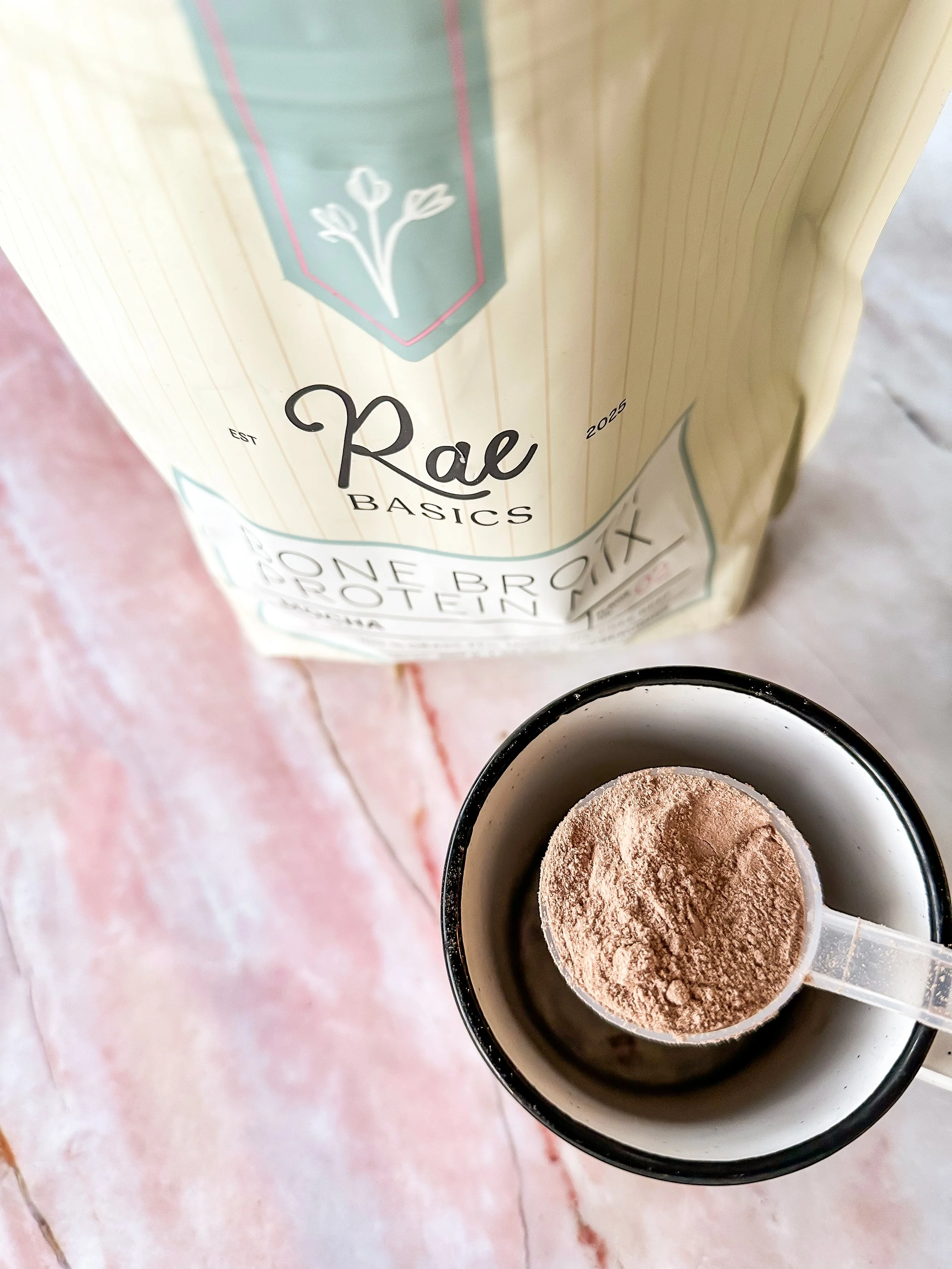 Scoop of RAE Basics Mocha Bone Broth