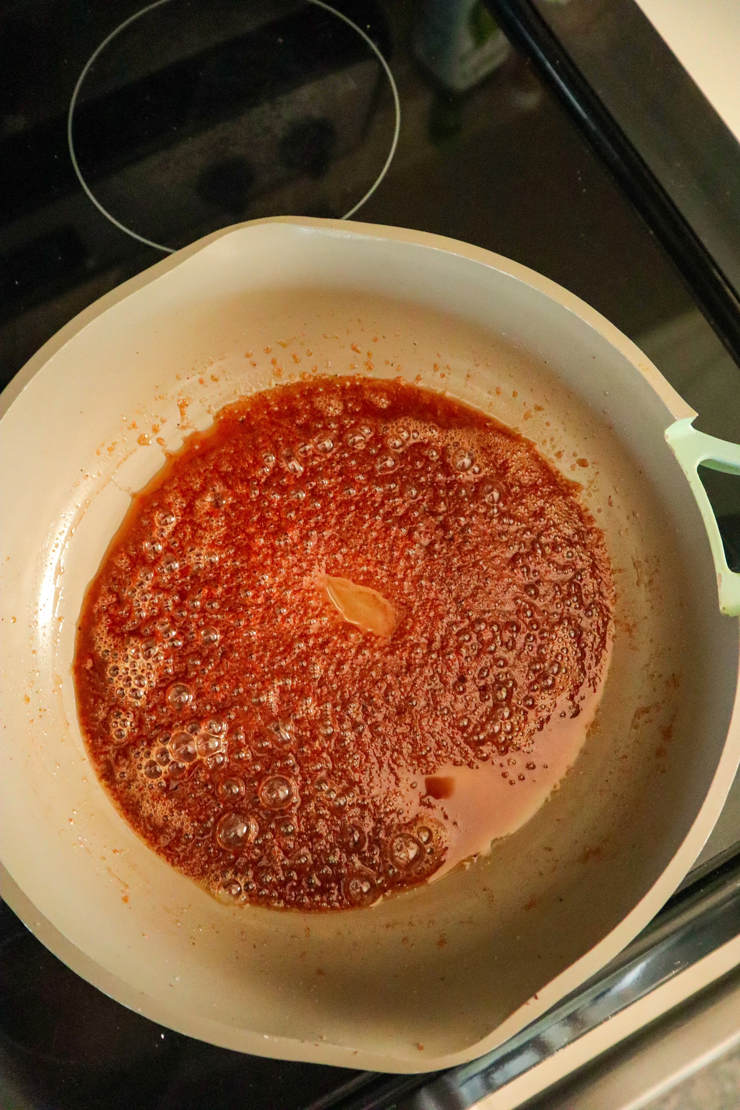  Bubbling cinnamon sugar mixture in a pan, ready for the toasted pecans. 