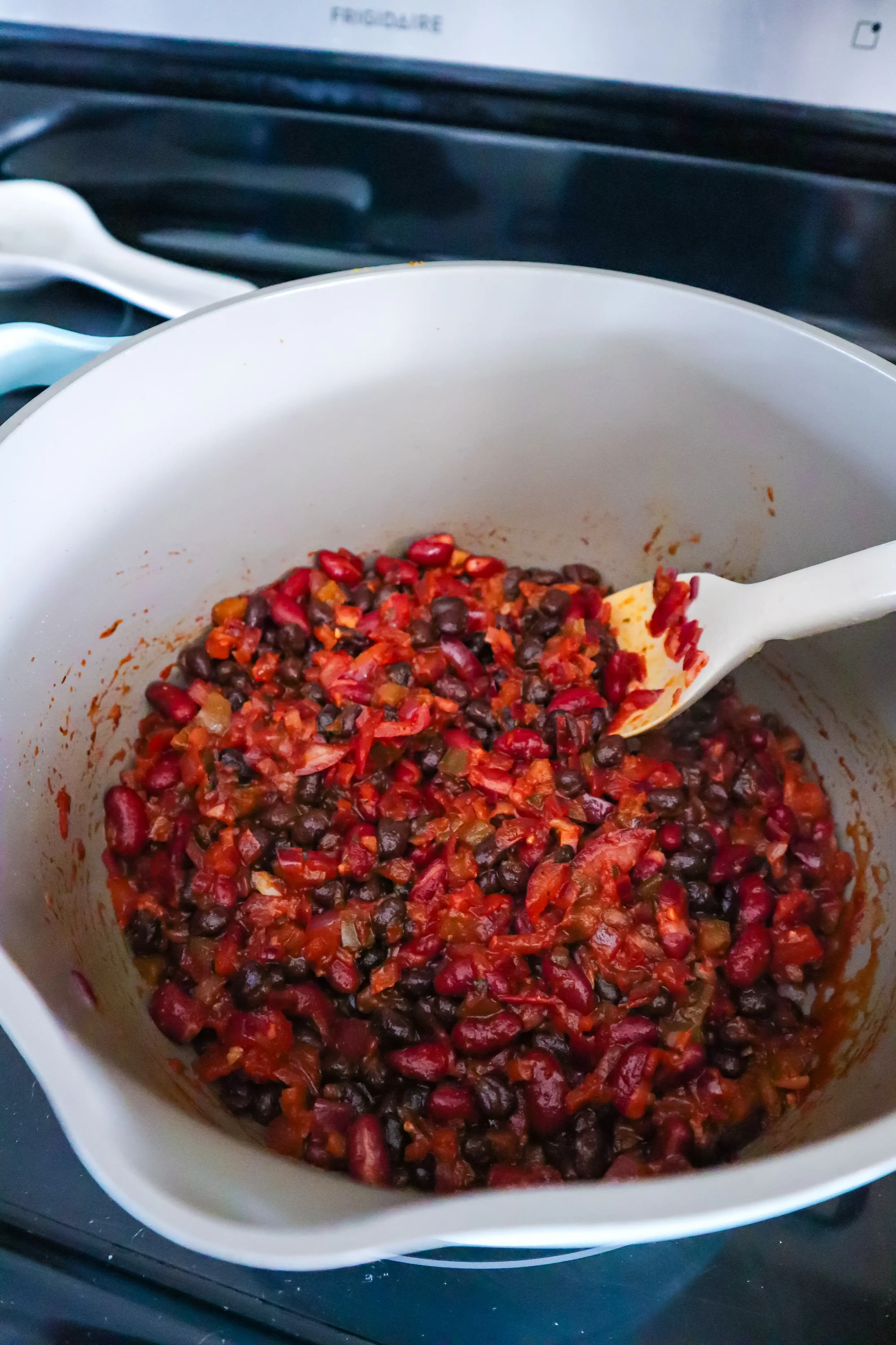add beans into pot vegetarian chili - jazzleaf.webp