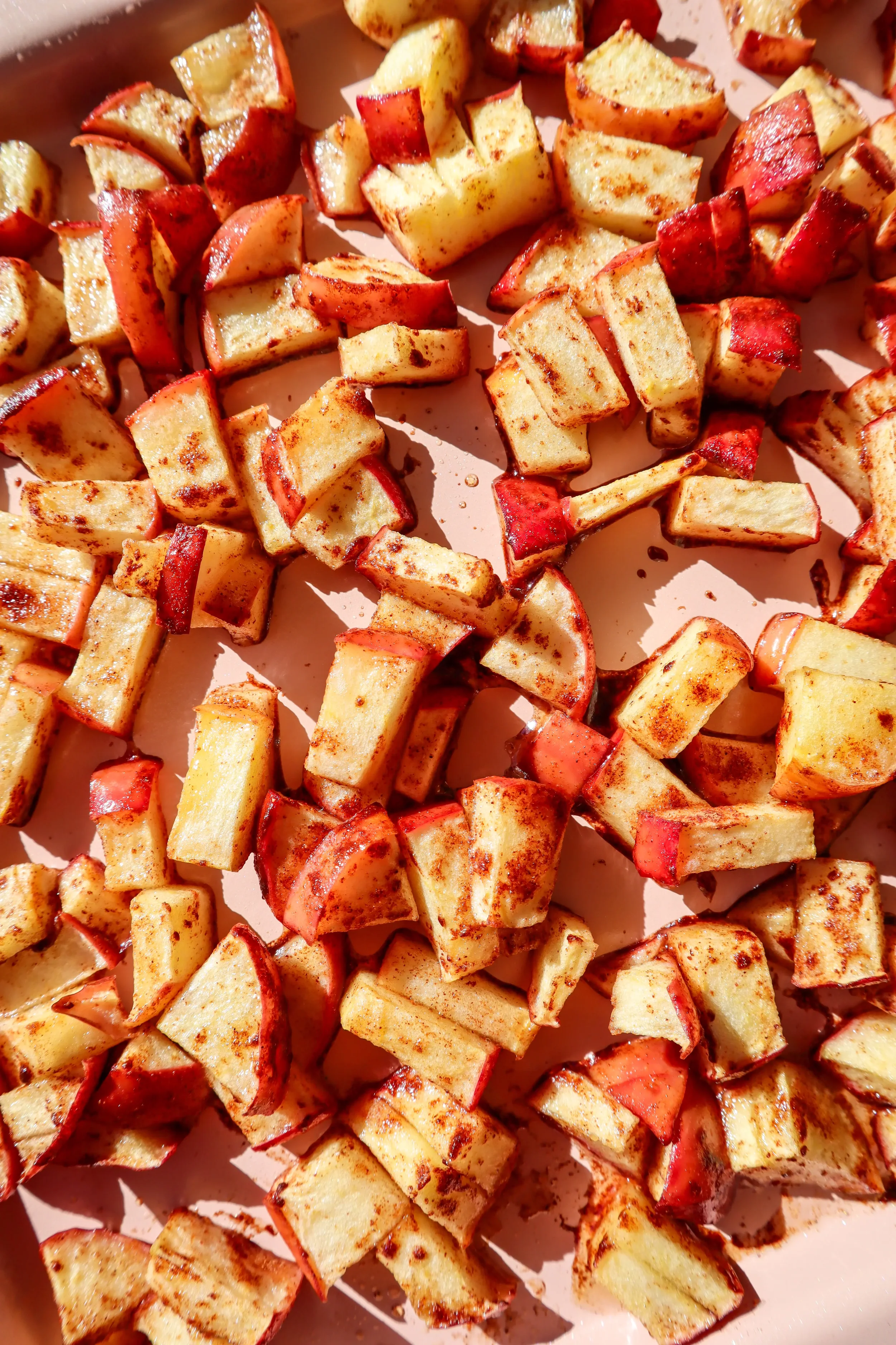  Cooked air fryer apples with cinnamon, lightly caramelized and golden. 