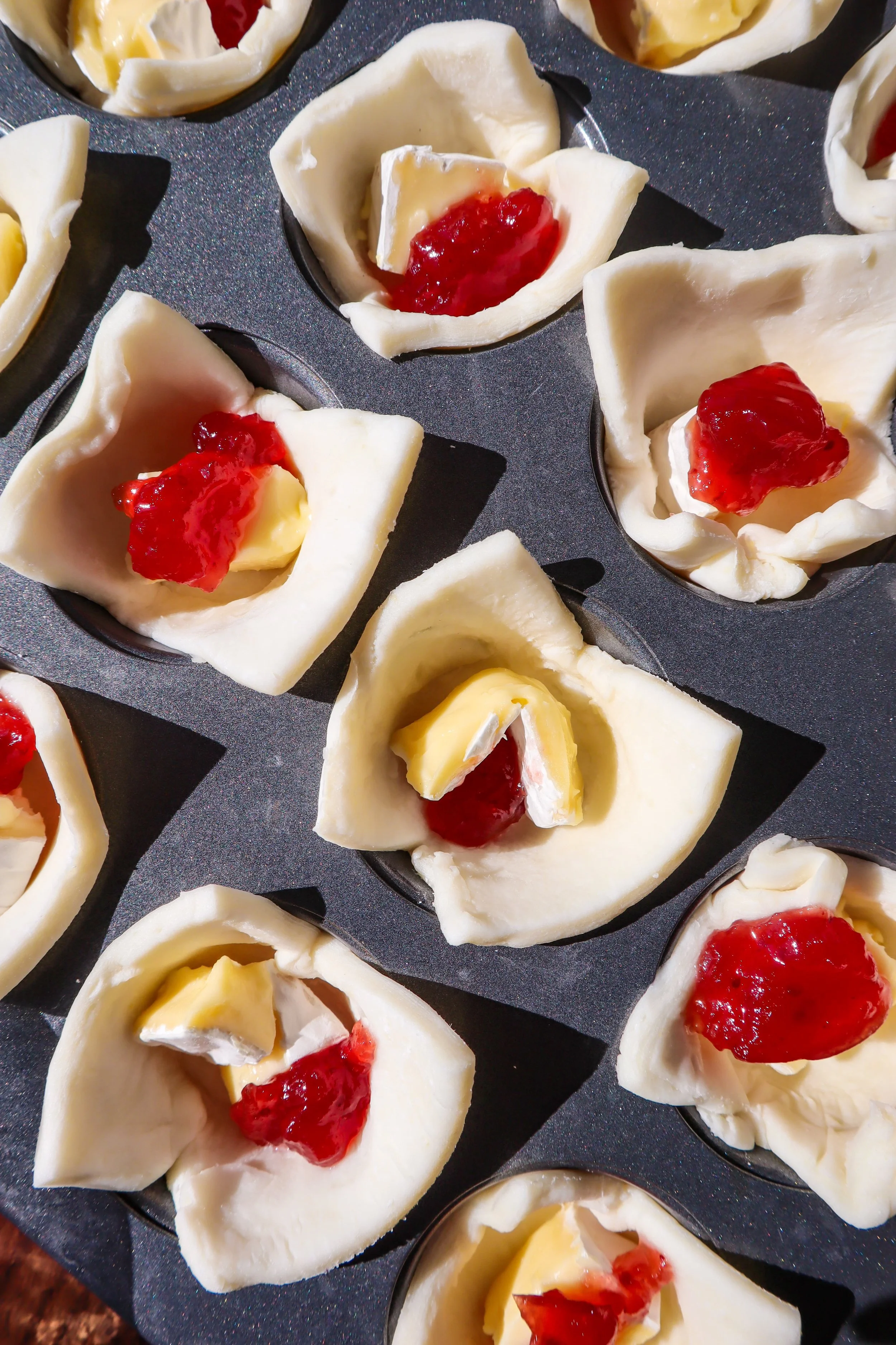 adding-cranberry-sauce-to-puff-pastry-cups (1).jpg