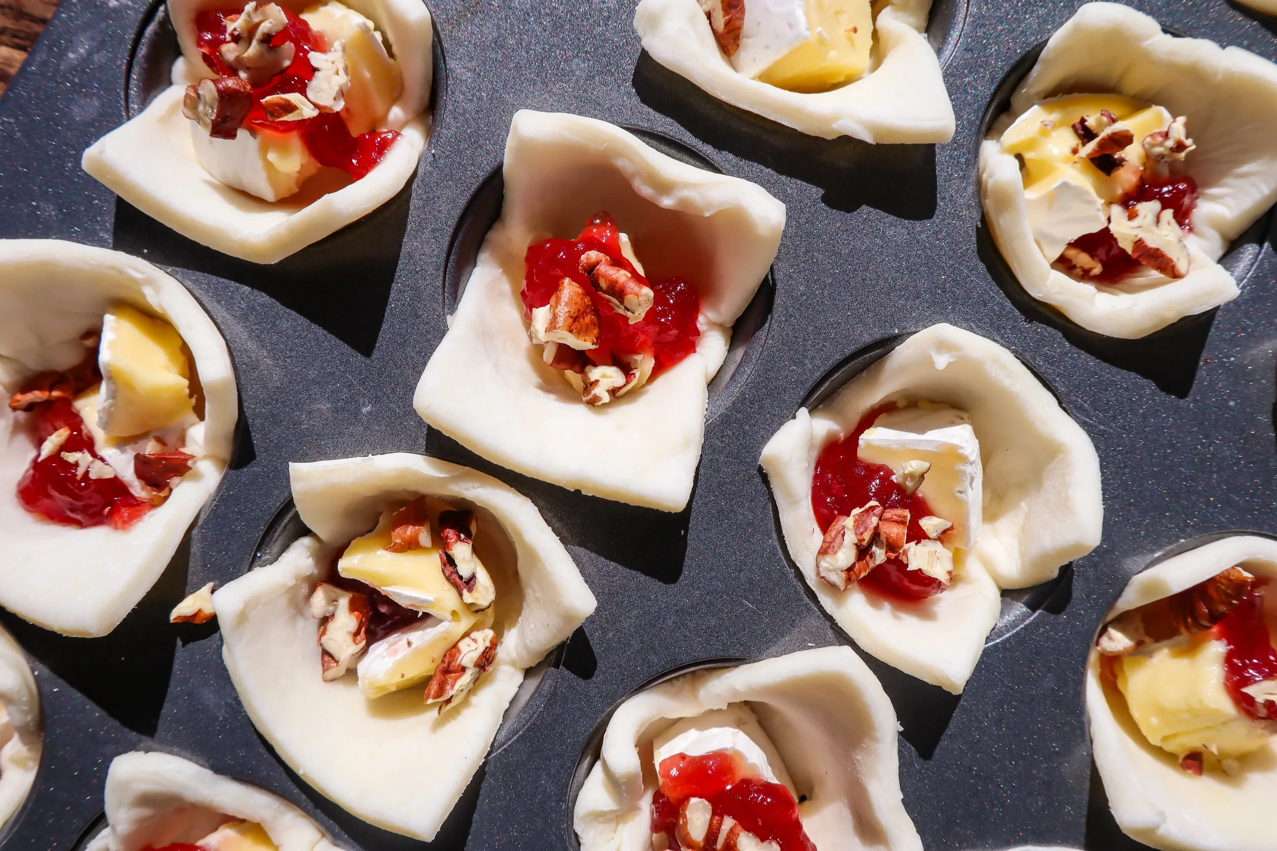 puff-pastry-cups-with-brie-before-baking.webp