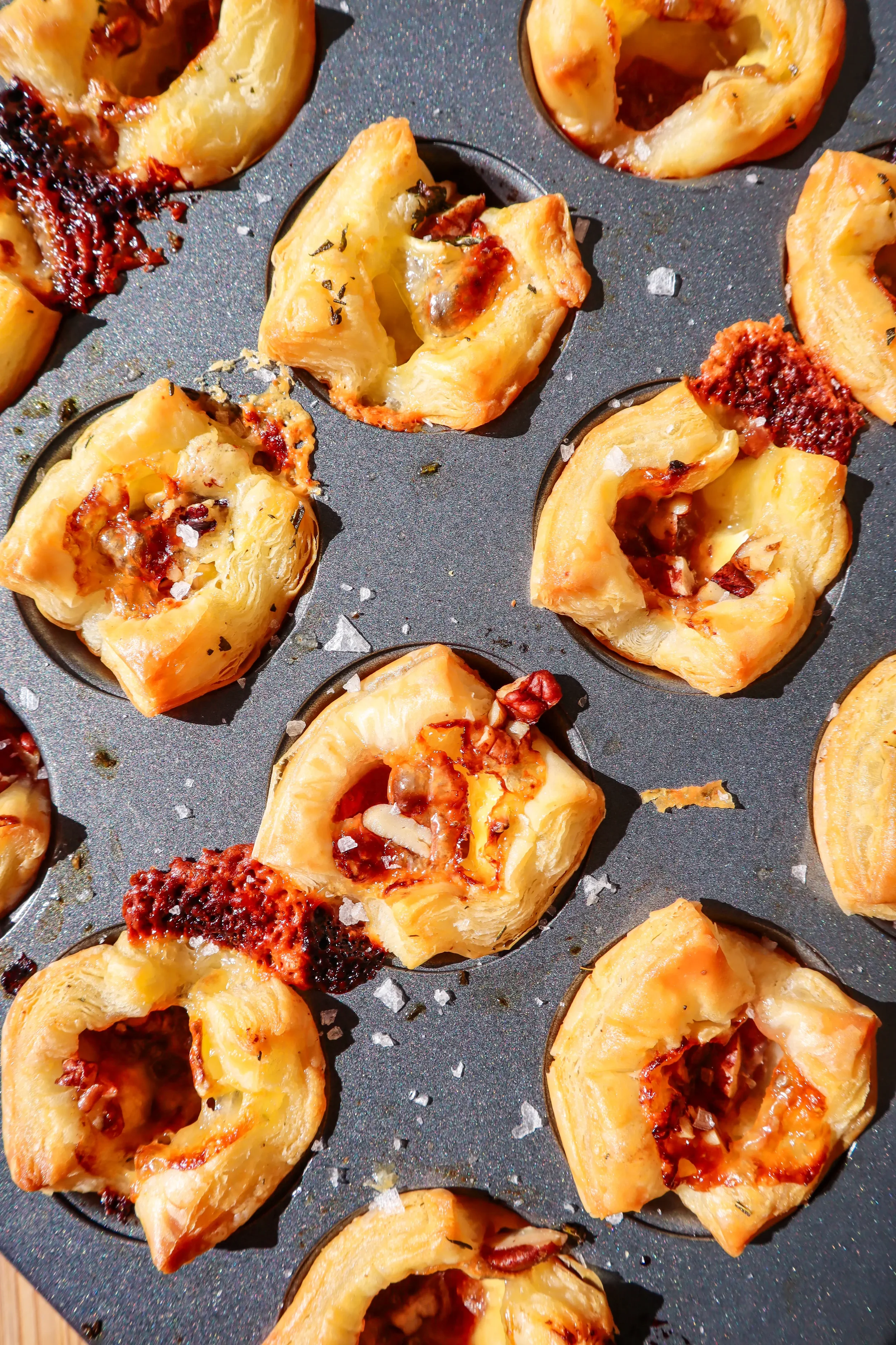 baked-cranberry-brie-bites-on-baking-sheet.webp