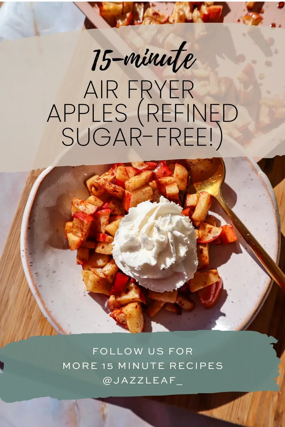 Bowl of cinnamon air fryer apples topped with whipped cream, with text reading “15-minute air fryer apples (refined sugar-free).