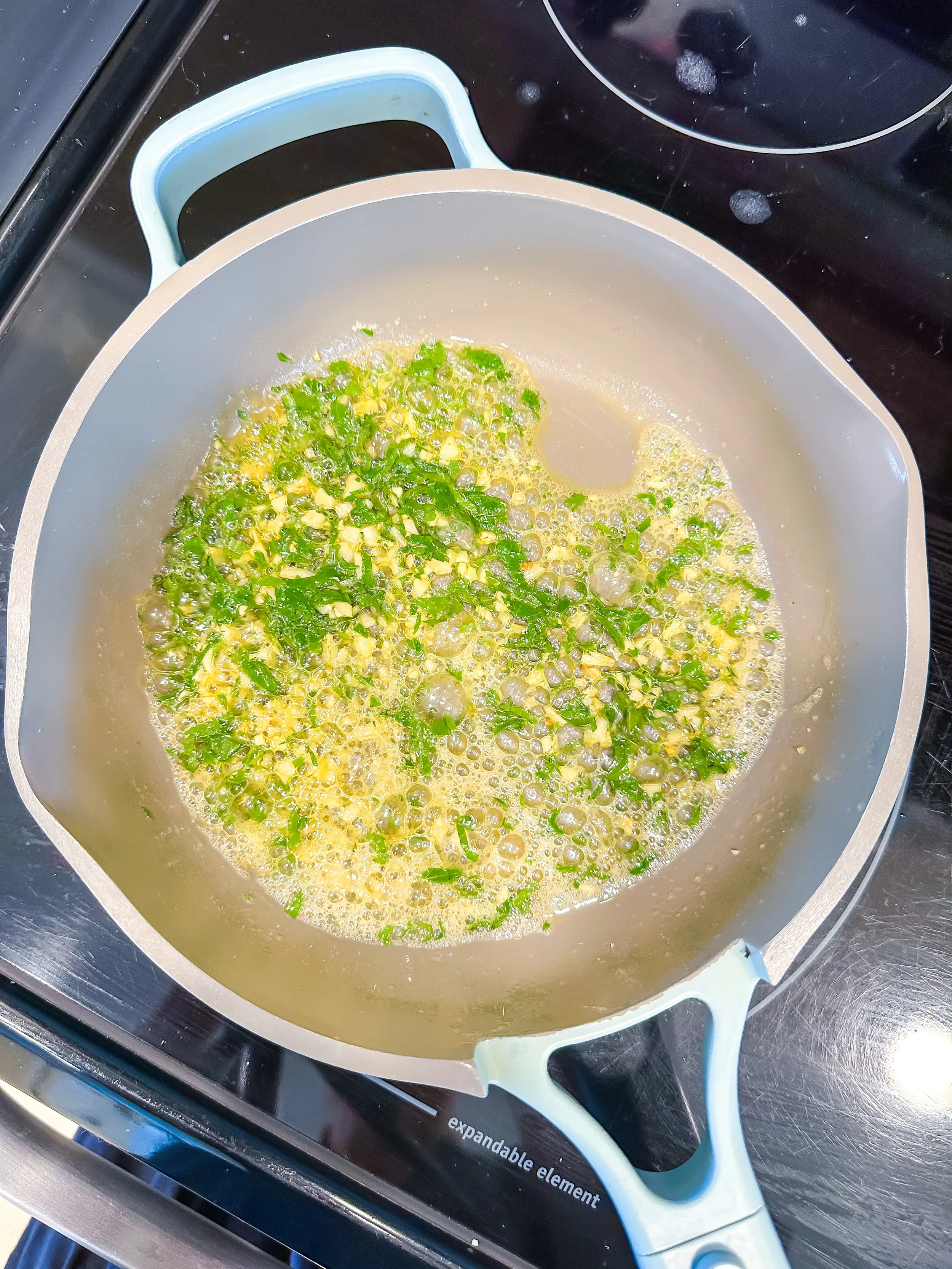 finished butter and garlic sauce for steak bites in pan