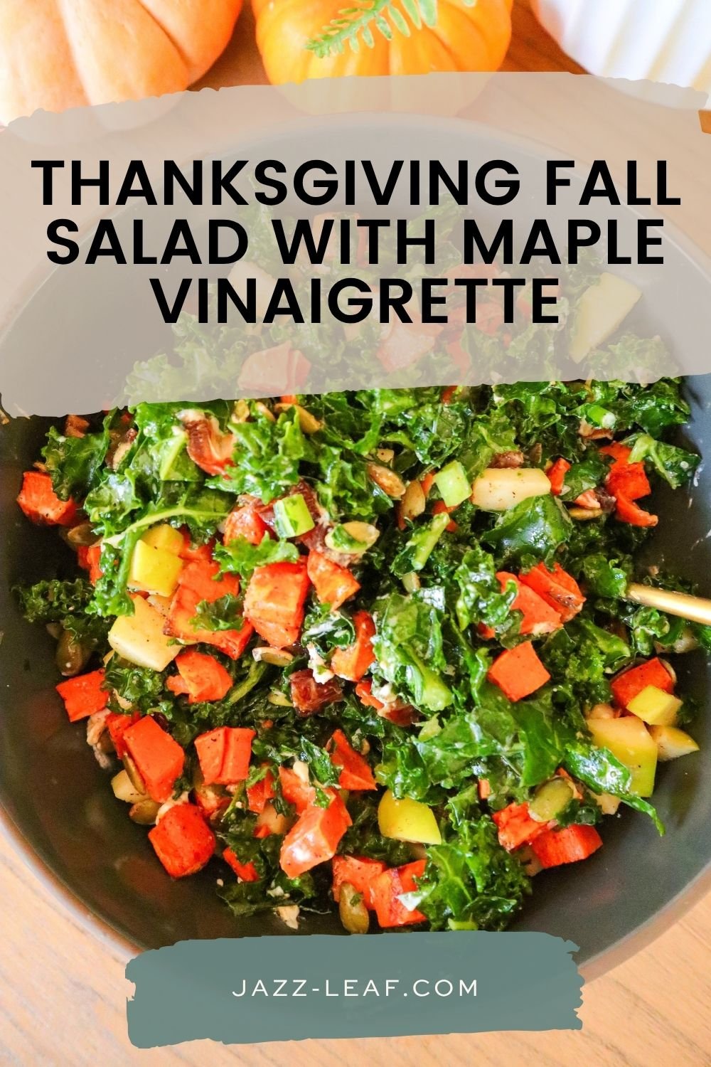 Thanksgiving fall salad with roasted sweet potatoes, kale, sliced apples, goat cheese, pecans, and dried cranberries in a serving bowl