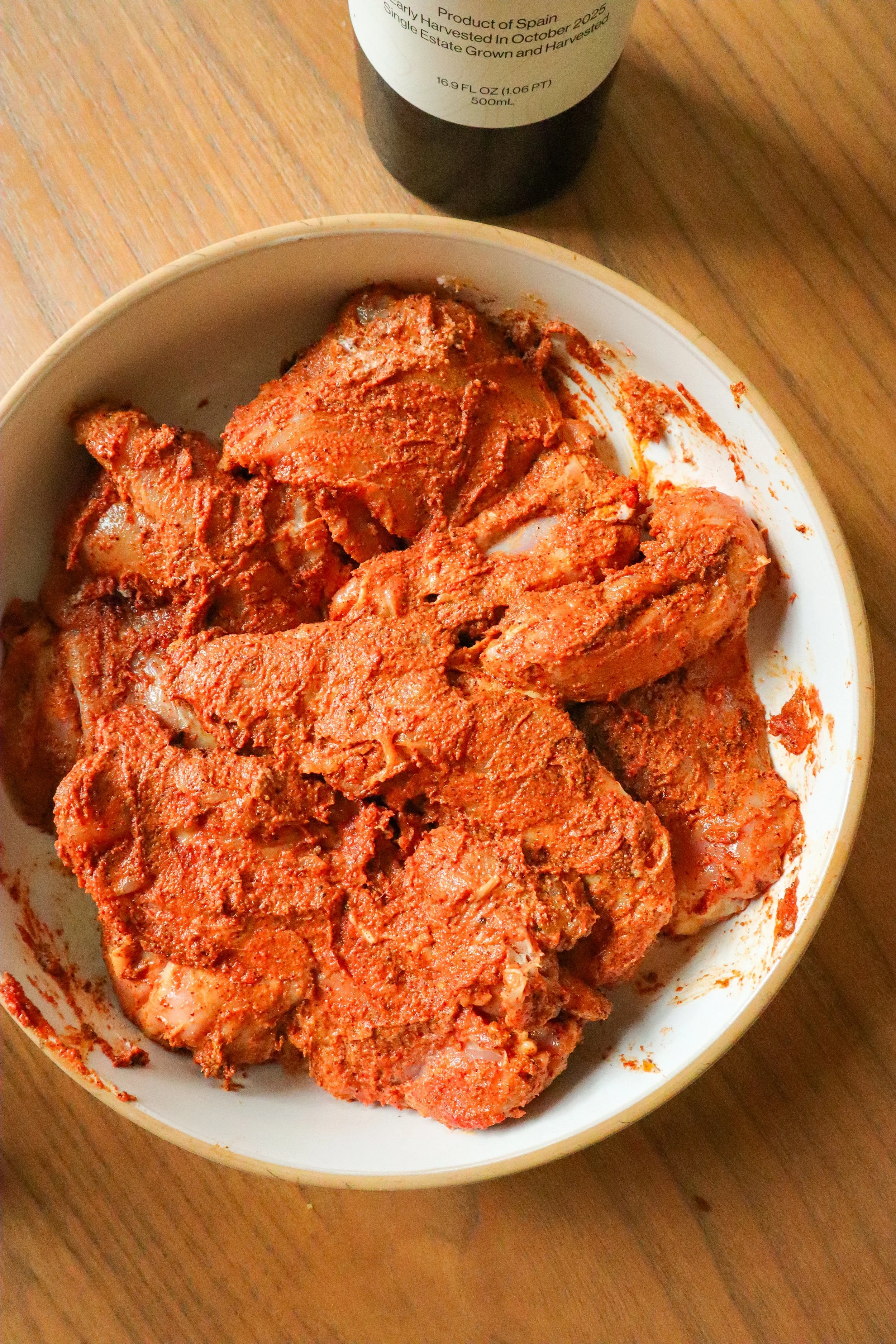 chicken thighs marinating in shawarma seasoning