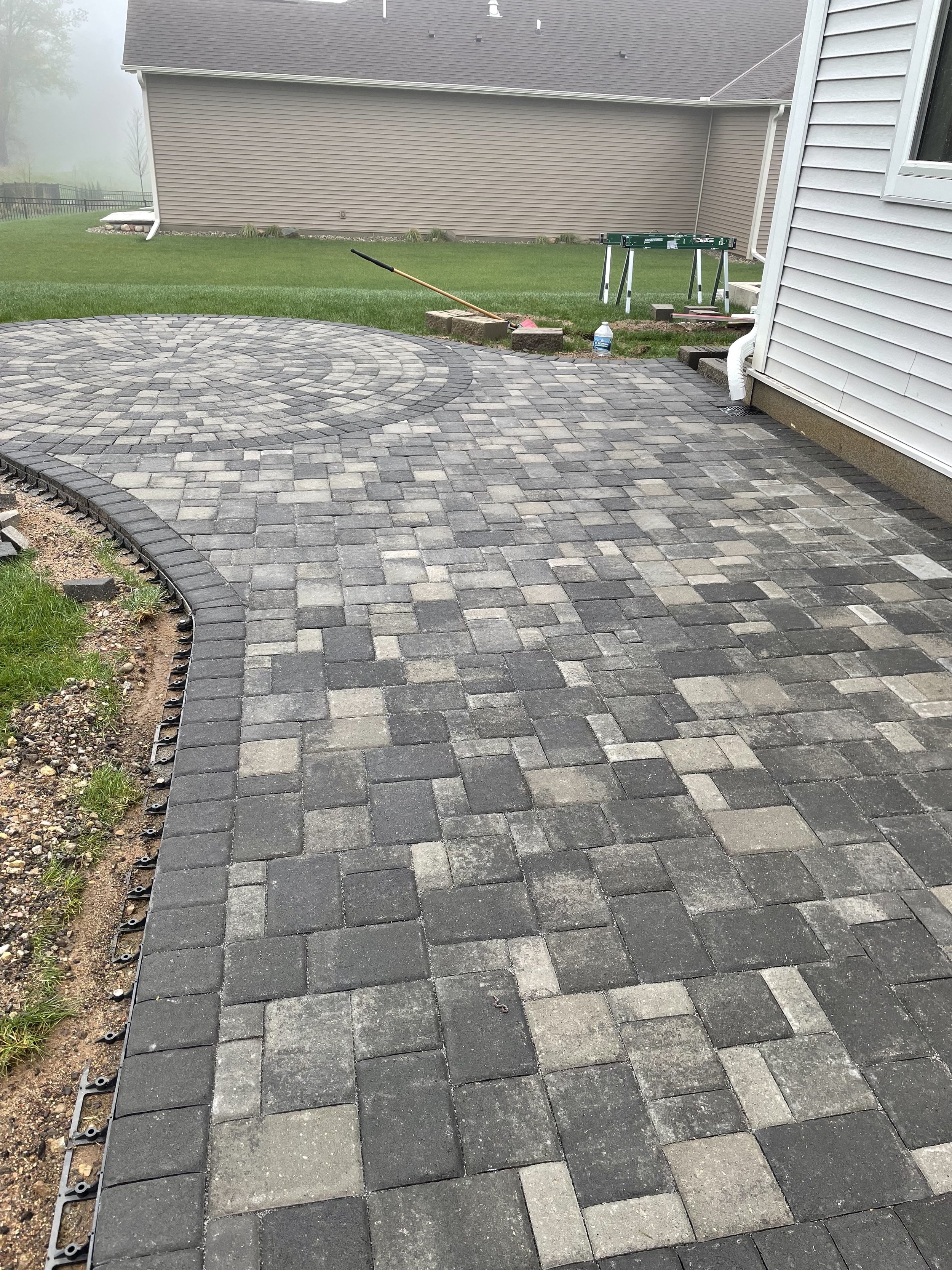 MB Landscapes installed a newly paved patio with a irregular shape.