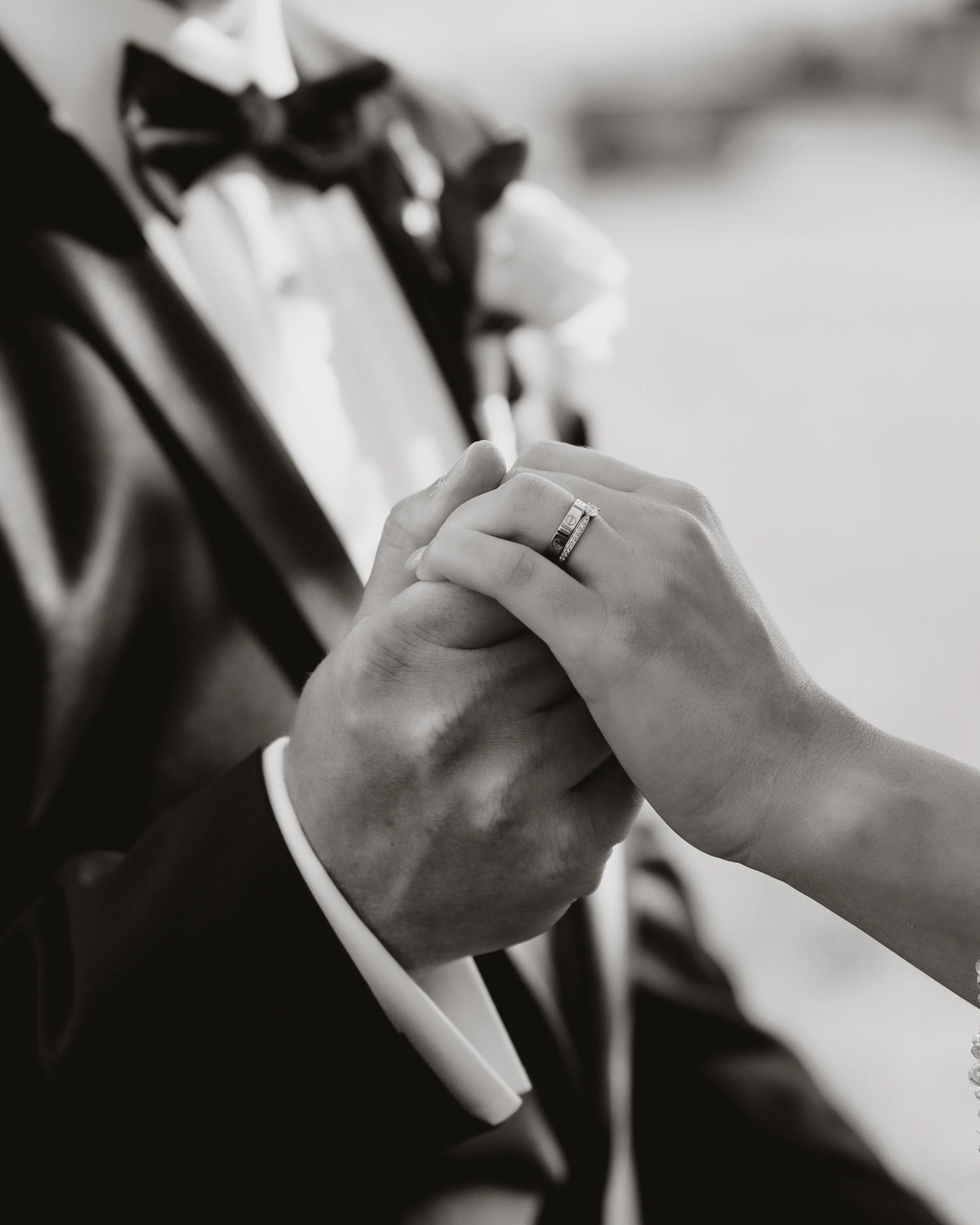 Bride and groom holding hands during their wedding ceremony, photographed by Shadowfax Photography in Melbourne.