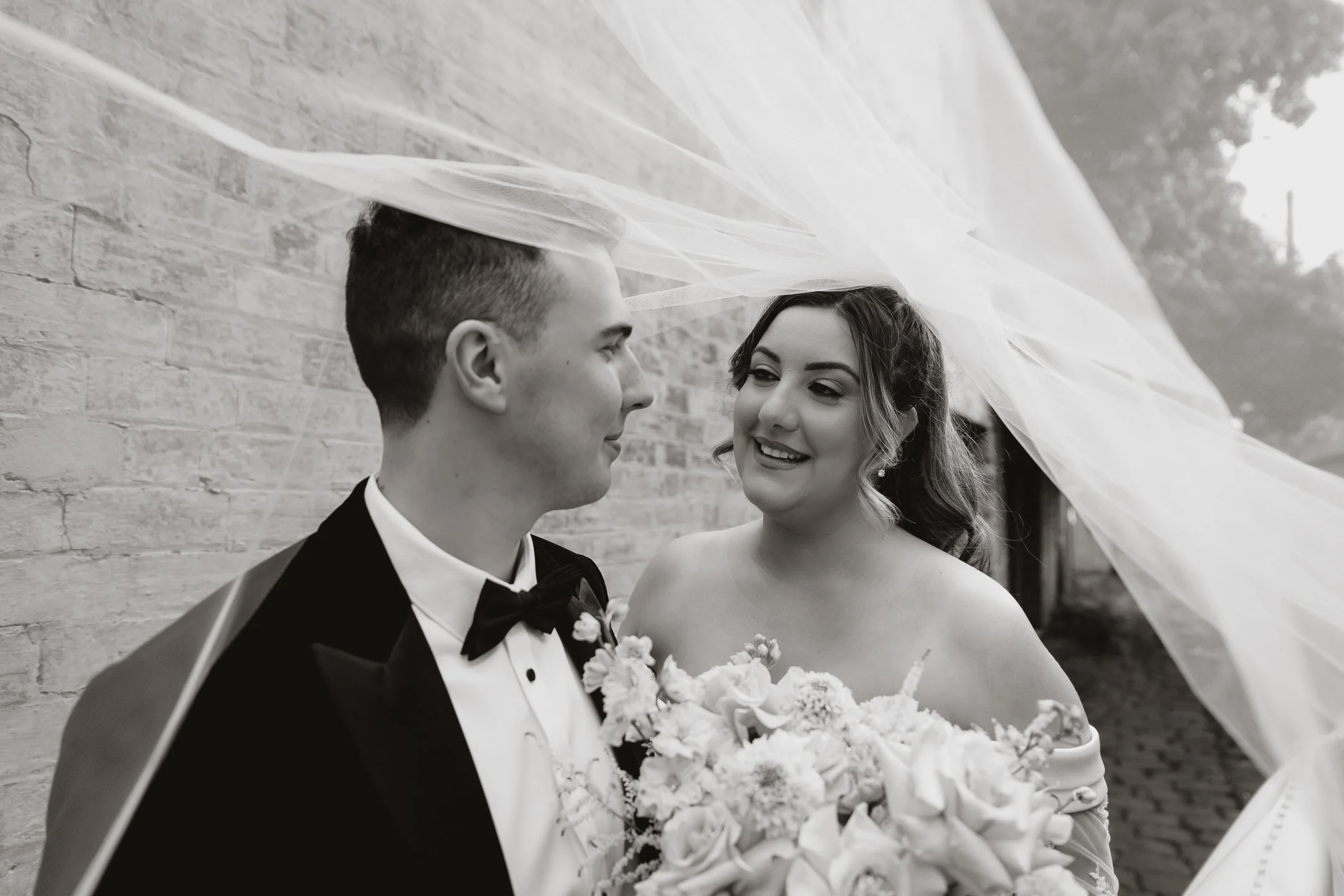 Bride and groom smiling under the veil on their wedding day, photographed by Shadowfax Photography in Melbourne.