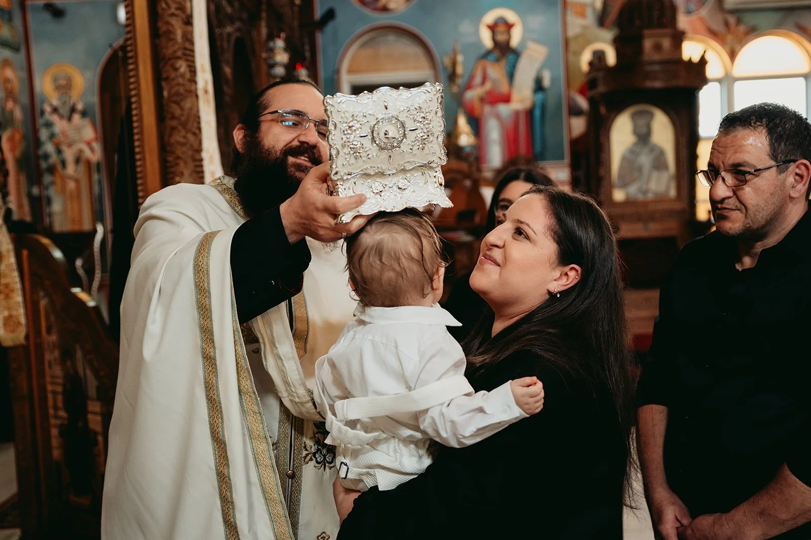 Mother and Child at Christening and Baptism Photographed at Greek Orthodox Parish Of The Presentation Of Our Lord in Coburg Melbourne