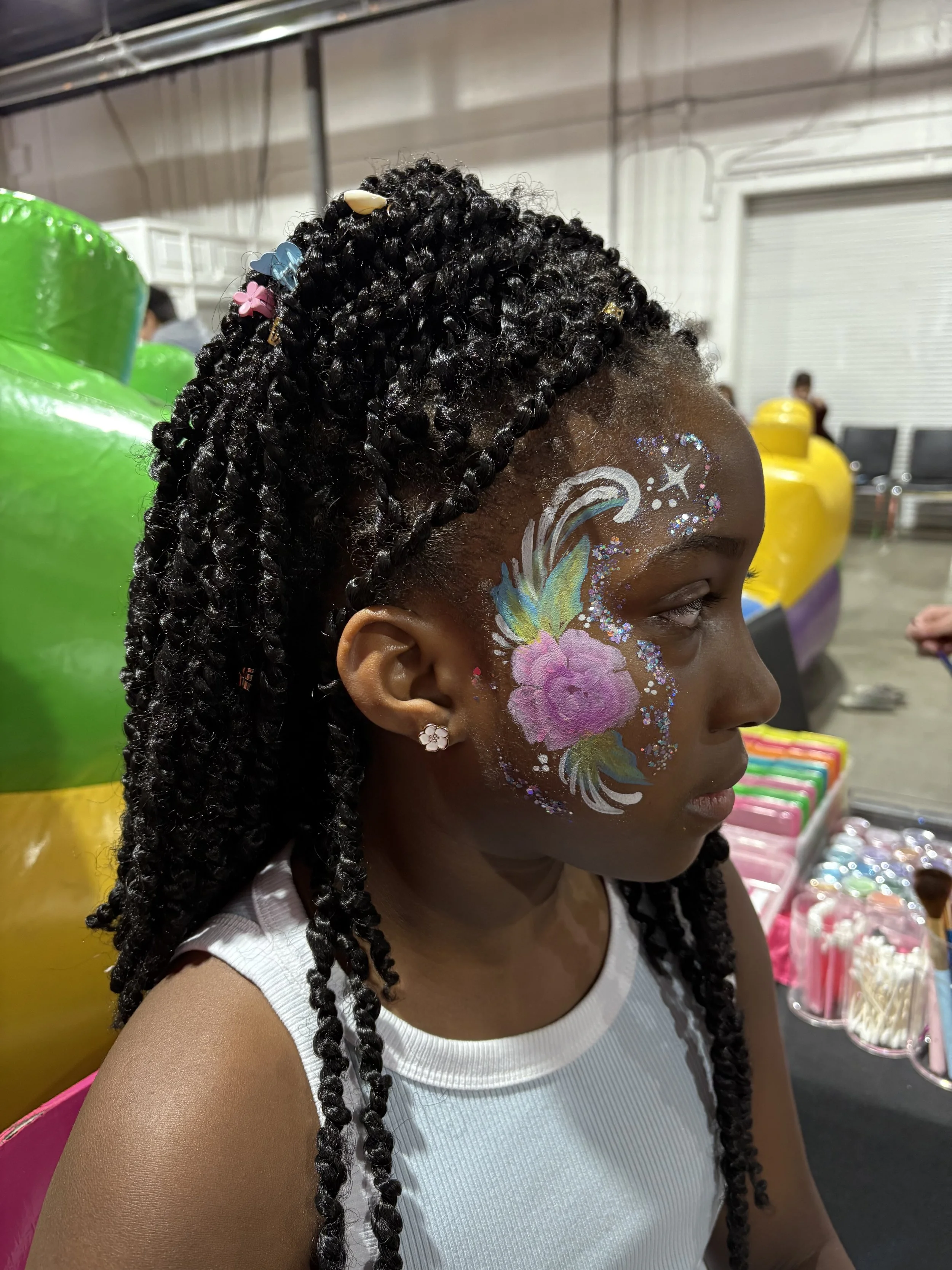 Kids flower face painting design by Magic Pixie Entertainment in Edmonton