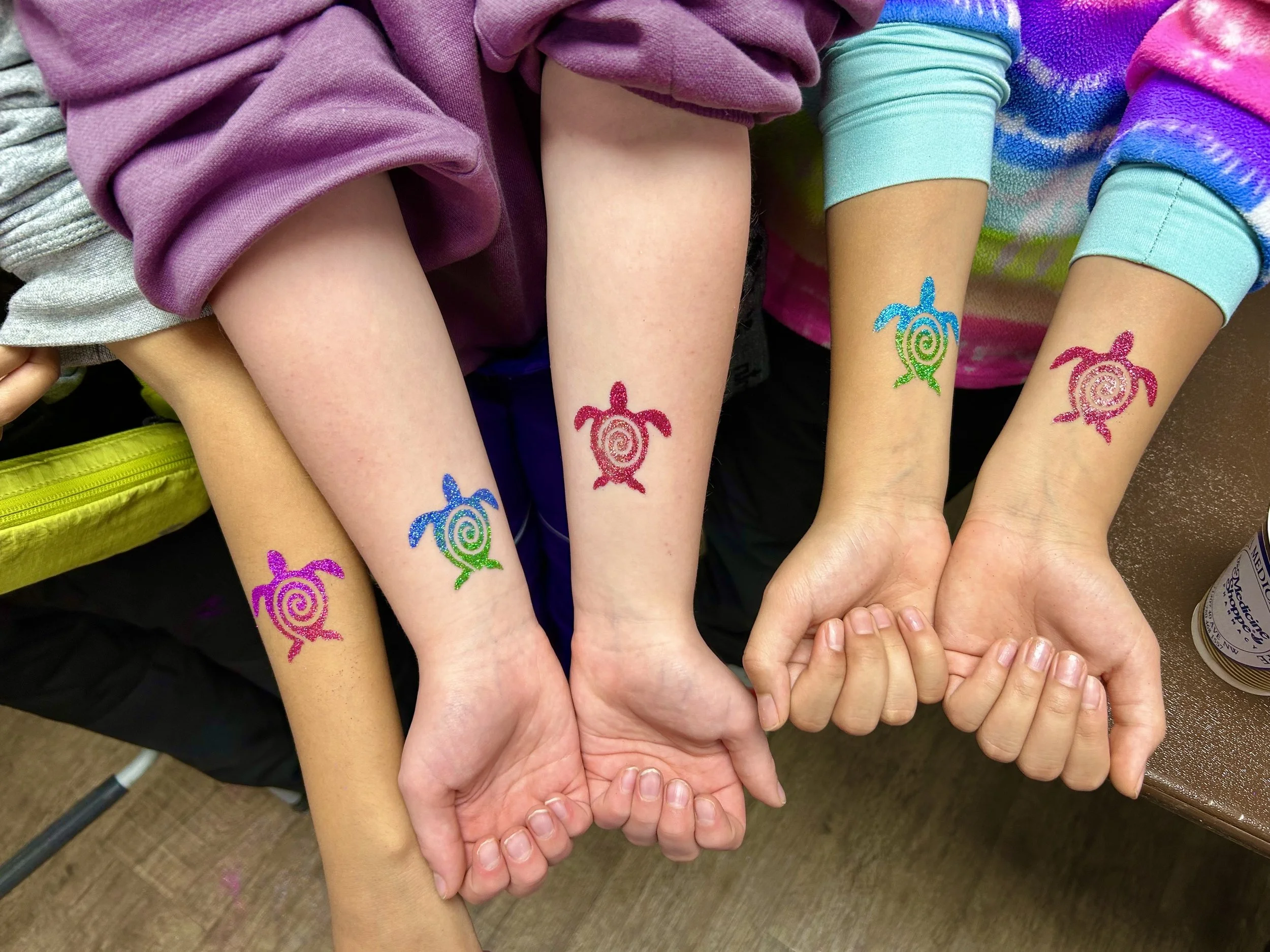Professional glitter tattoos at Alberta festival