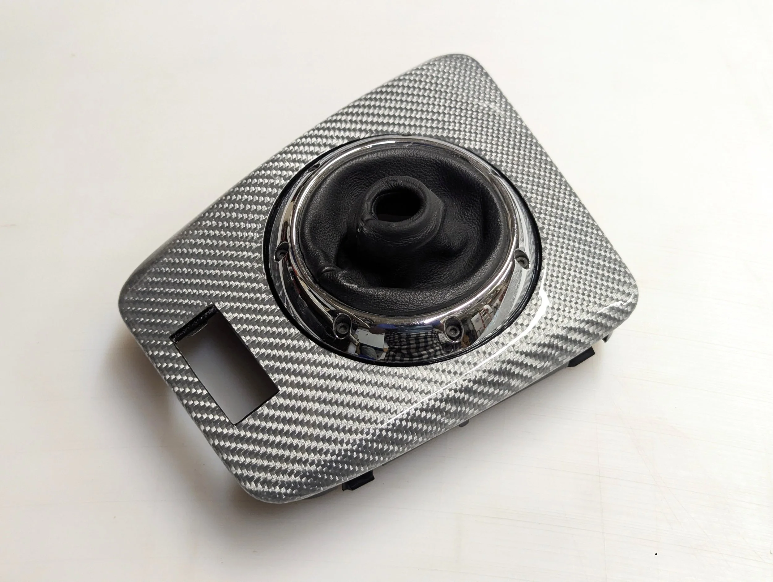 Custom skinned silver carbon fiber BMW shifter surround