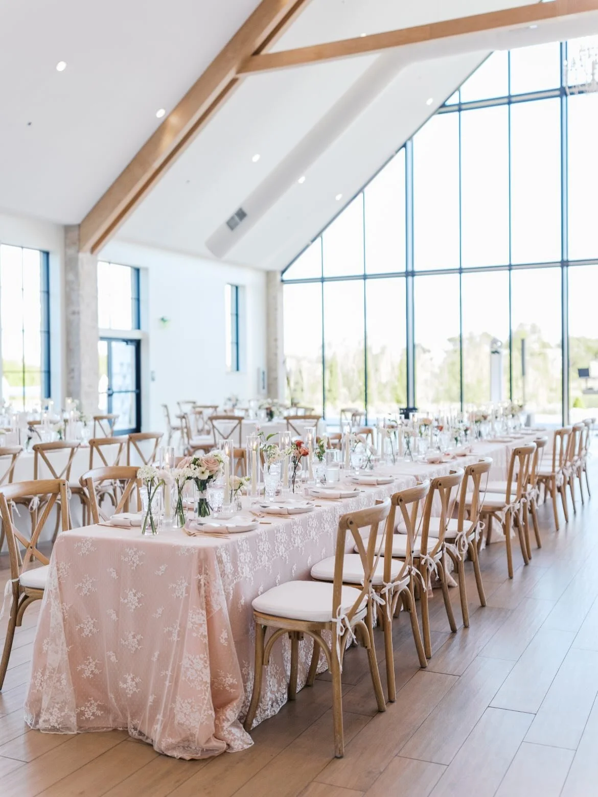 Blush Romance with Lace twists make up this gorgeous Reception hall! Our lace overlays allowed the head table to stand out &amp; went beautifully with our gorgeous centerpieces and candlelight for The Legg&rsquo;s big day!💗🌸💝🎀🩷

Venue: @thebower