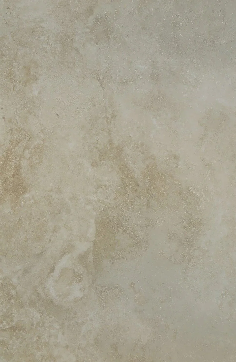 Close-up of beige marble or stone surface with natural veining and texture.