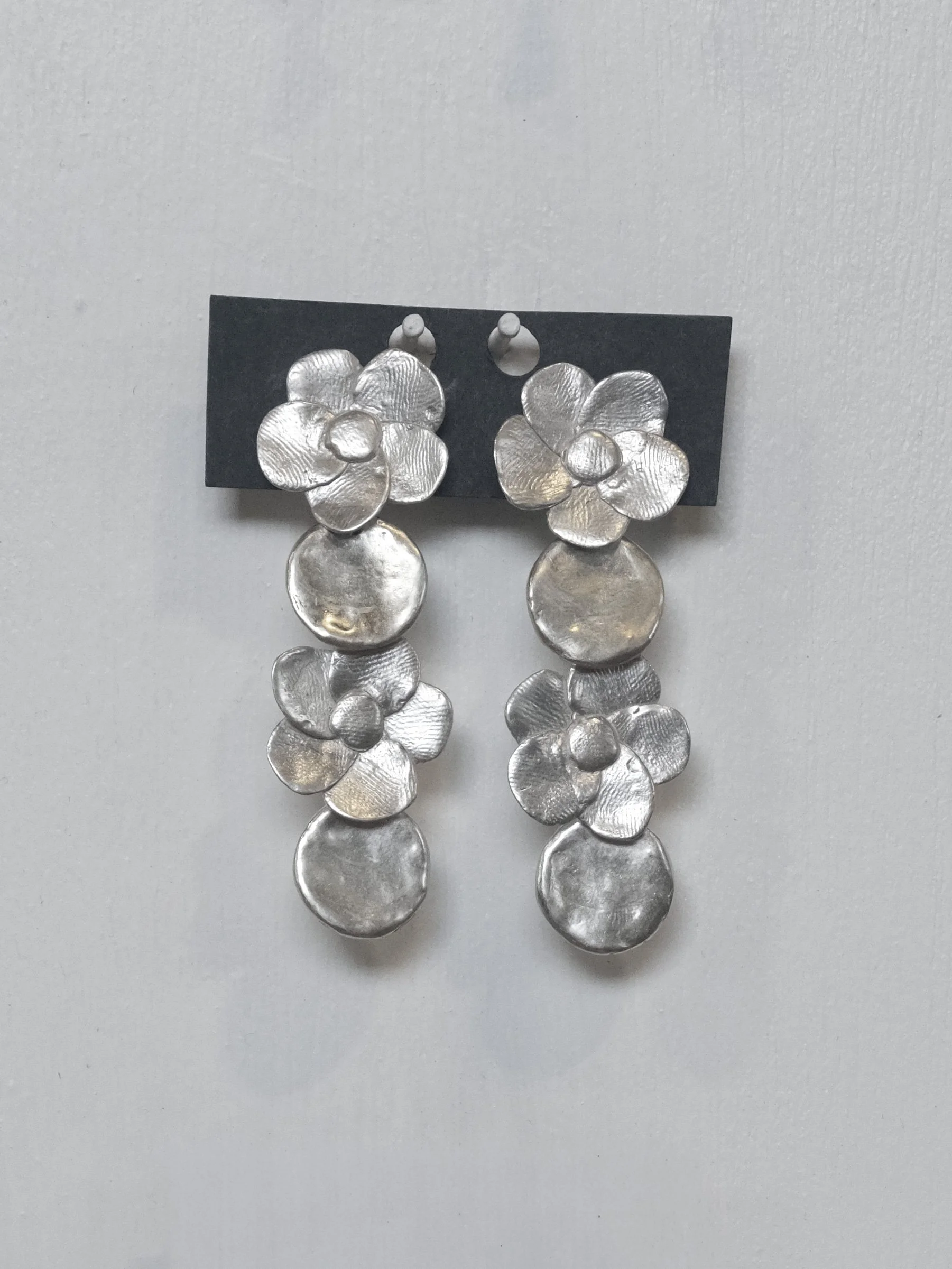 Double-Flower-+-Circle-Dangle-Earrings---silver-on-pegboard.jpg