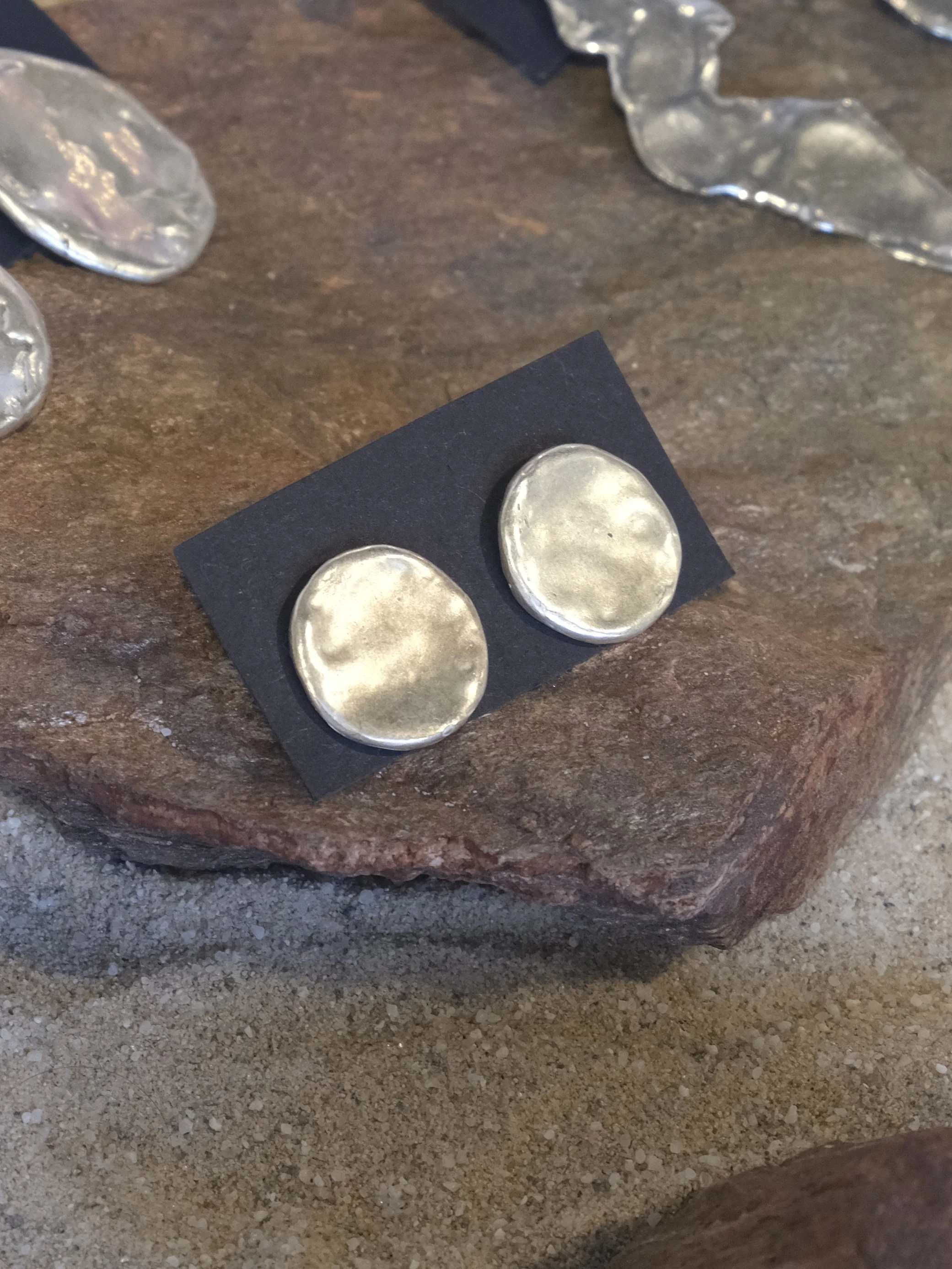 circle-earrings-on-rock.jpg
