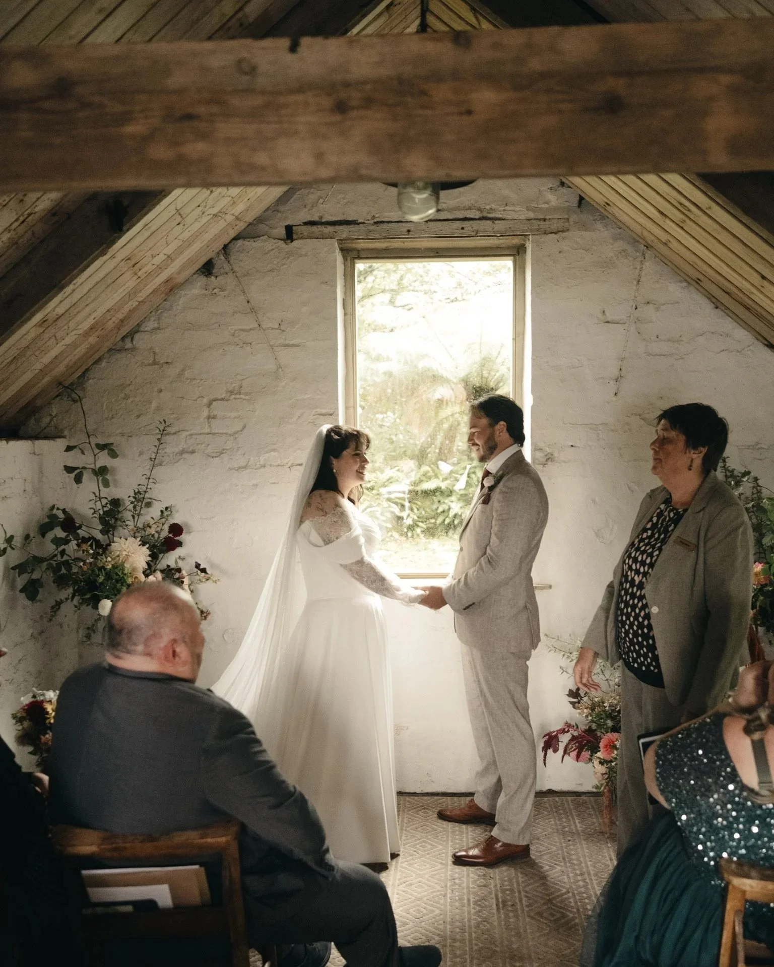 Couple getting married in the rustic Woodshed