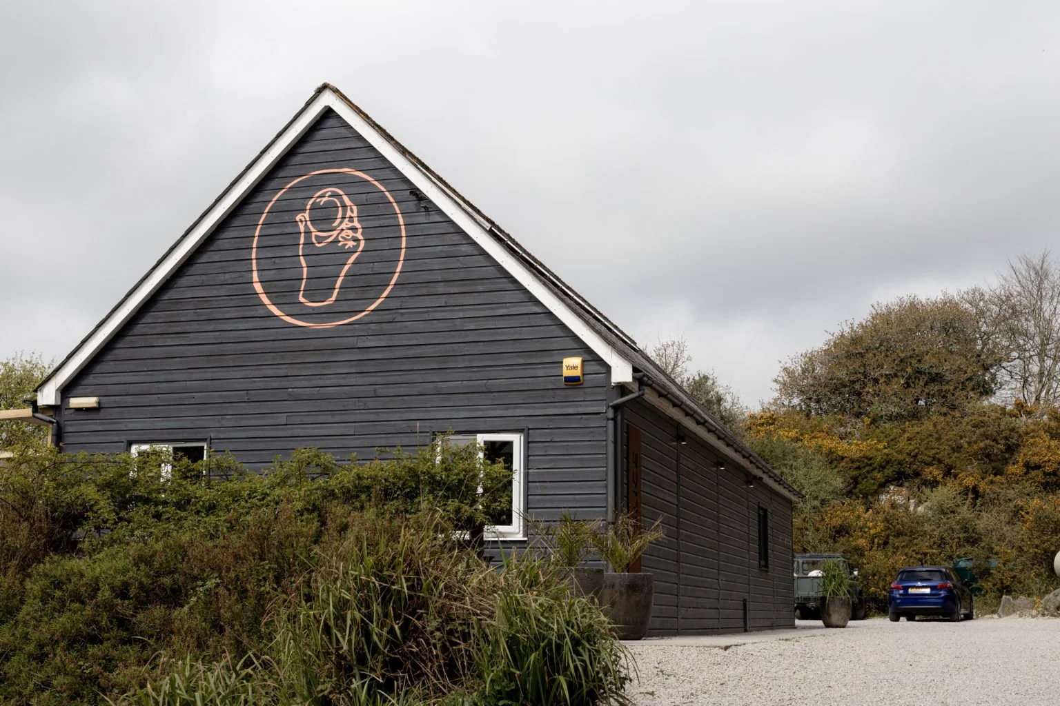 Wooden retaurant building, car park, Slice of Cornwall