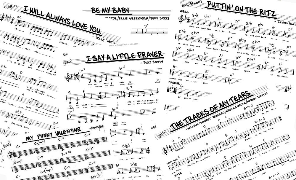 Sheet music pages with song titles written across the top, including 'I Will Always Love You,' 'Be My Baby,' 'Putin' on the Ritz,' 'I Say A Little Prayer,' 'My Funny Valentine,' and 'The Tracks of My Tears,' with musical notes and chords visible.