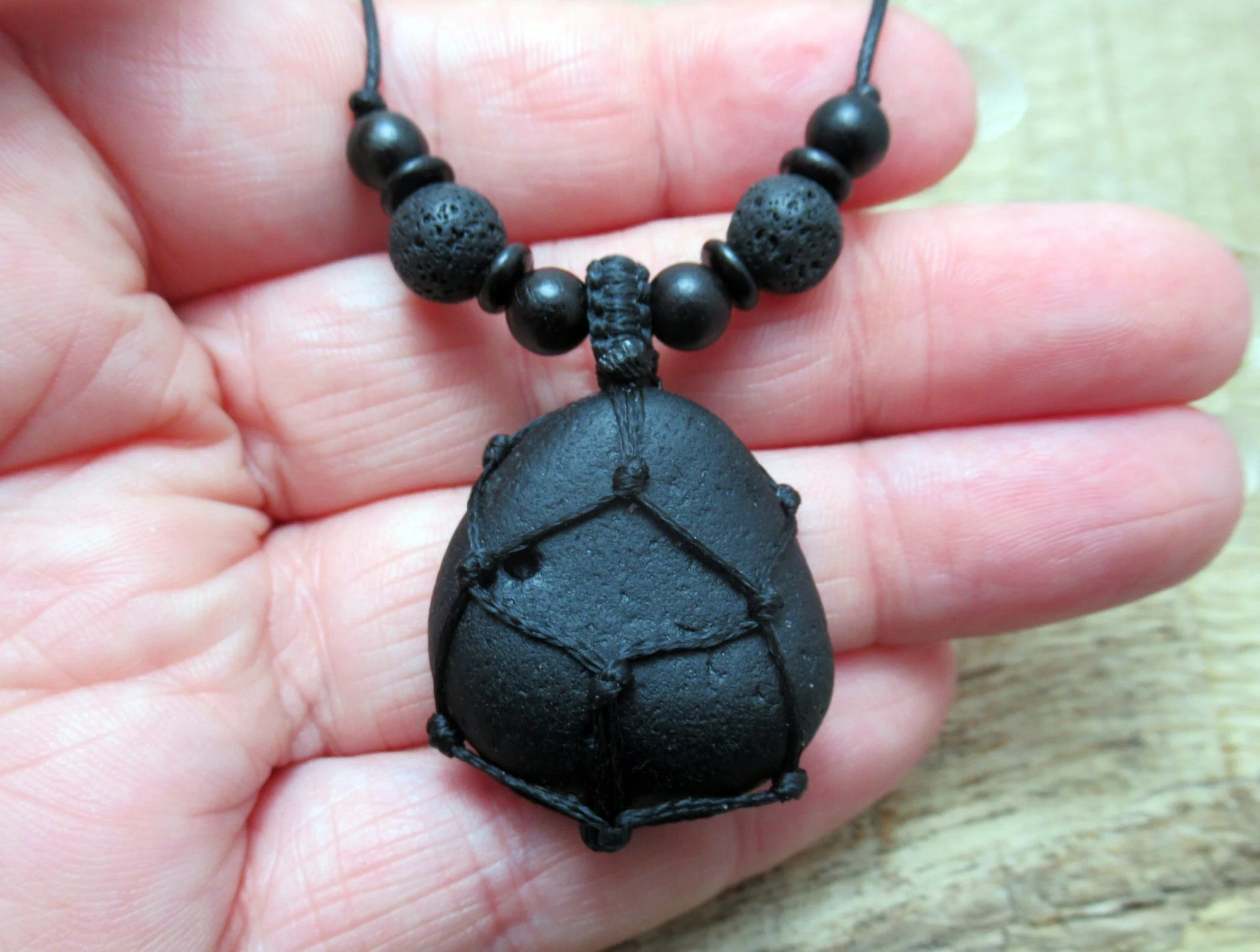 Pirate glass necklace with black lava stone and wood beads, old historic sea glass pendant