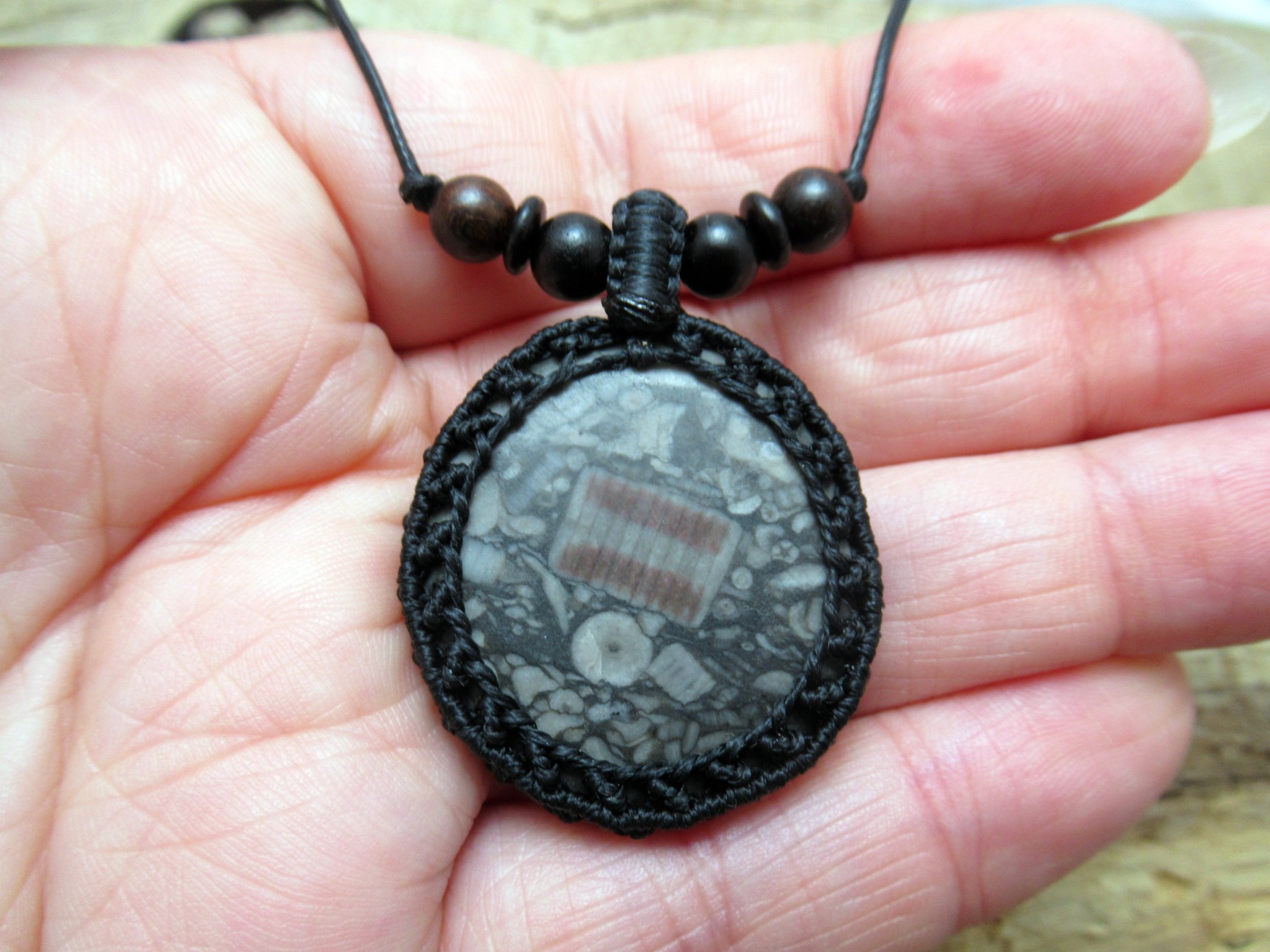 Detailed crinoid fossil macrame necklace, with mixed wood and coconut shell beads