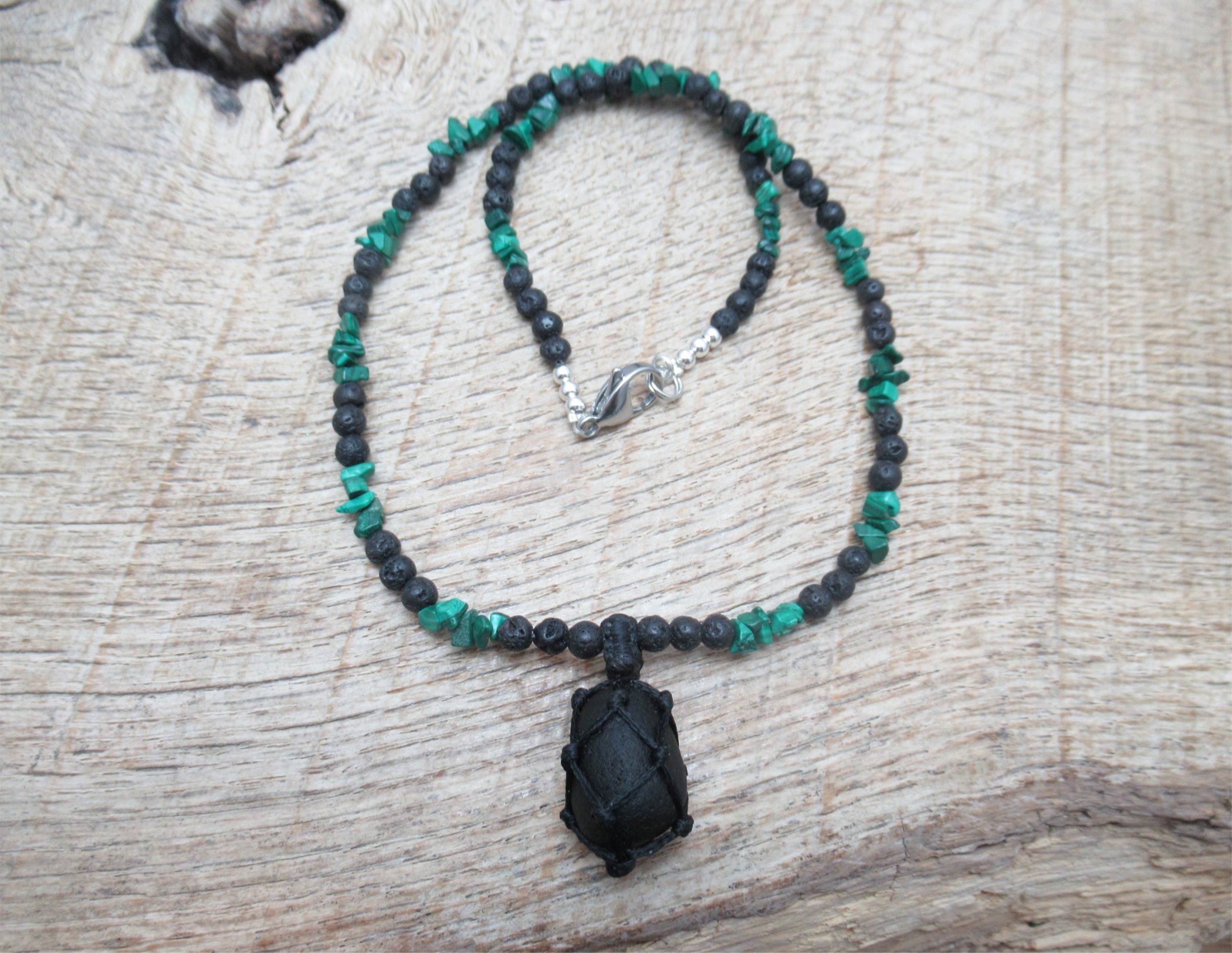 Small bright green pirate glass pendant on necklace with little malachite and black lava stone beads