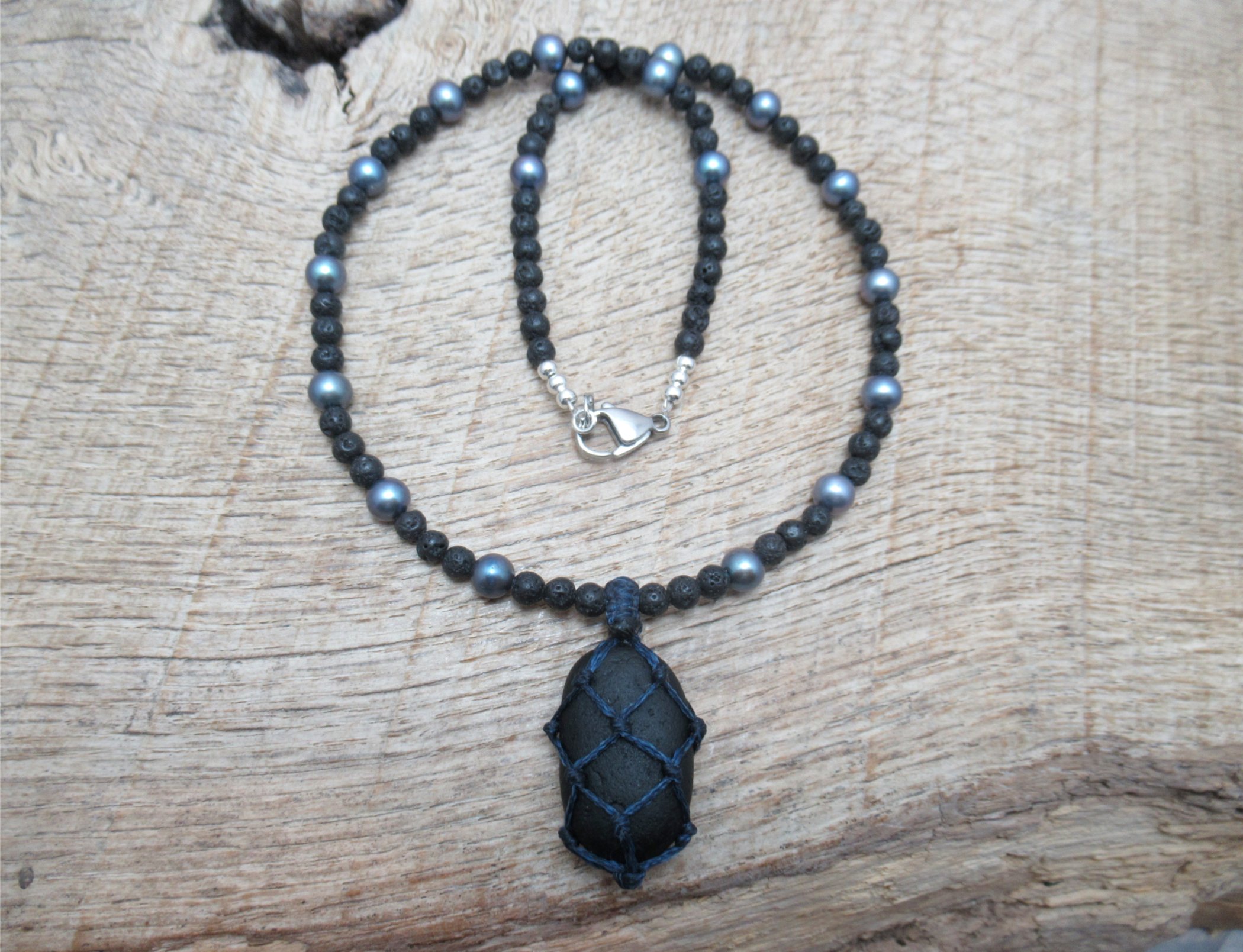 Lovely piece of pirate glass on necklace with real blue pearls and black lava stone beads, historic sea glass necklace