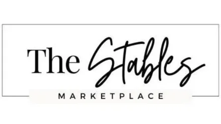Logo for The Stables Marketplace with stylized script and bold text